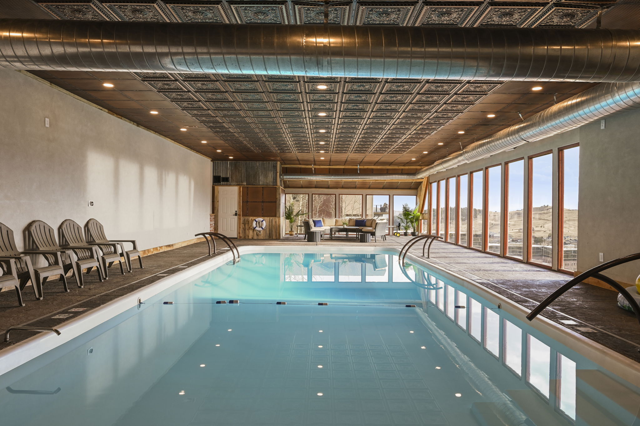 Enjoy a swim in the enormous indoor pool overlooking stunning mountain views