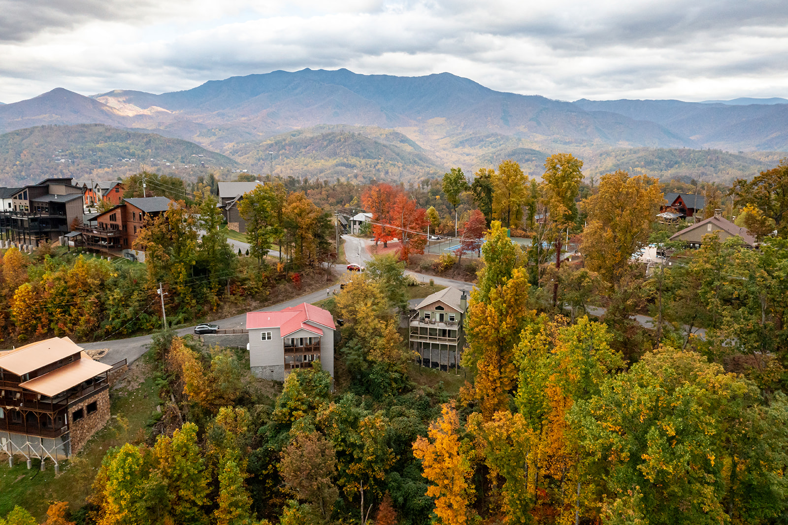 Drone view of chalet atop Chalet Village with Mt Leconte view