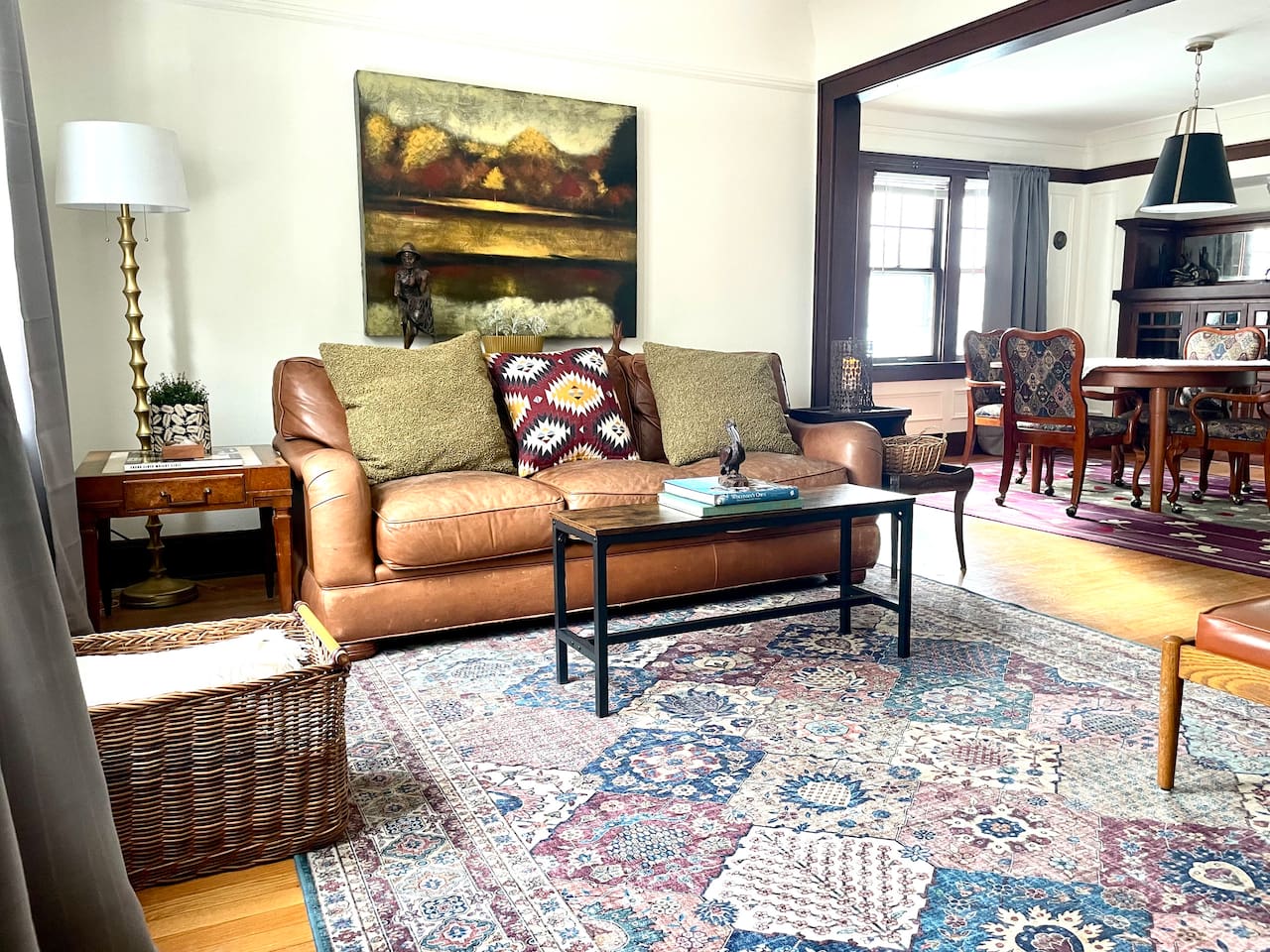 A welcoming living space with plush seating, curated décor, and natural light—designed for slow mornings, cozy evenings, and easy connection to the dining area.