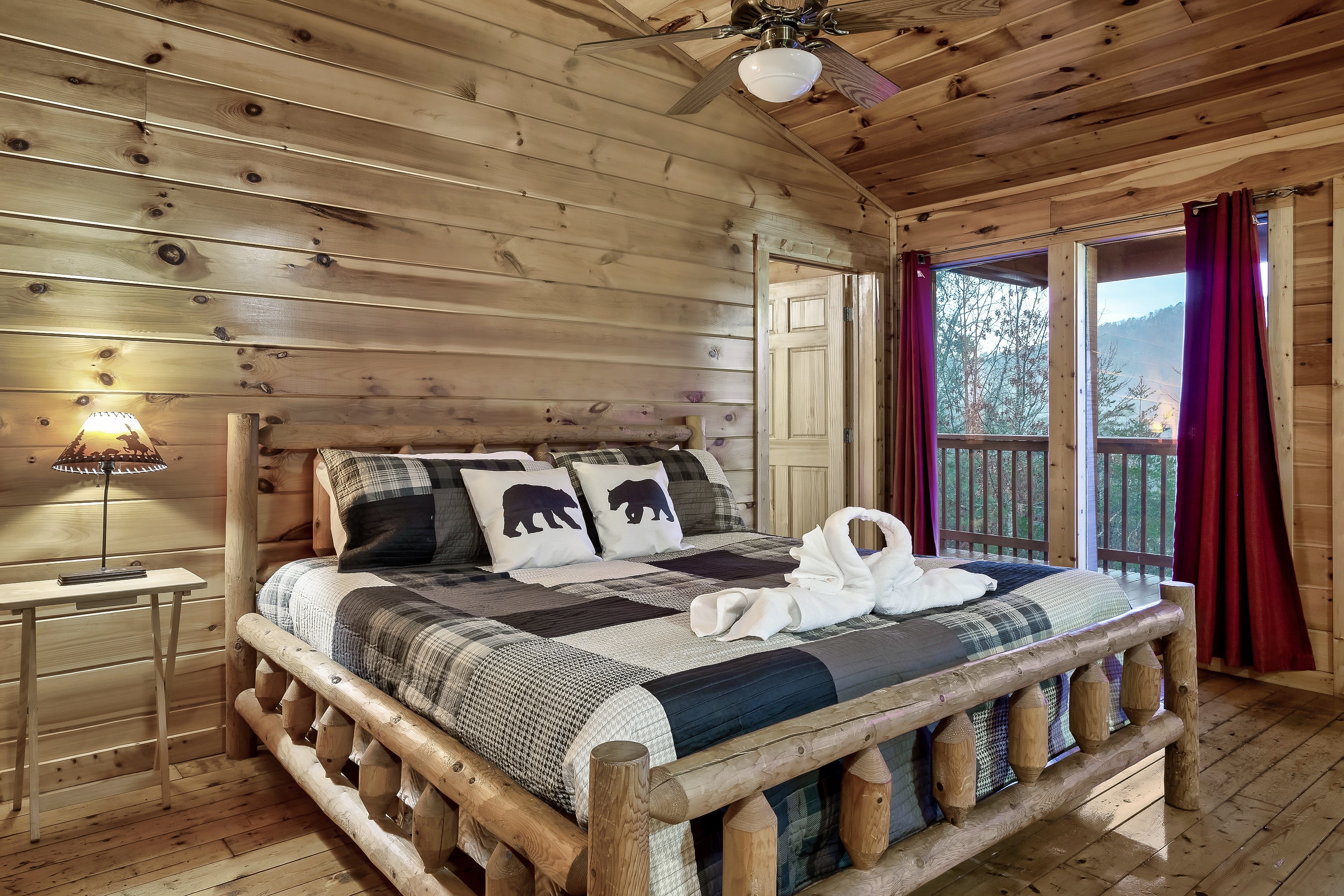Share a relaxing escape in an upstairs king bedroom where warmth, comfort, and mountain charm come together.