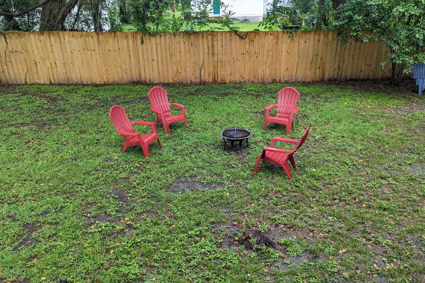 Gather with friends by the fire in the backyard