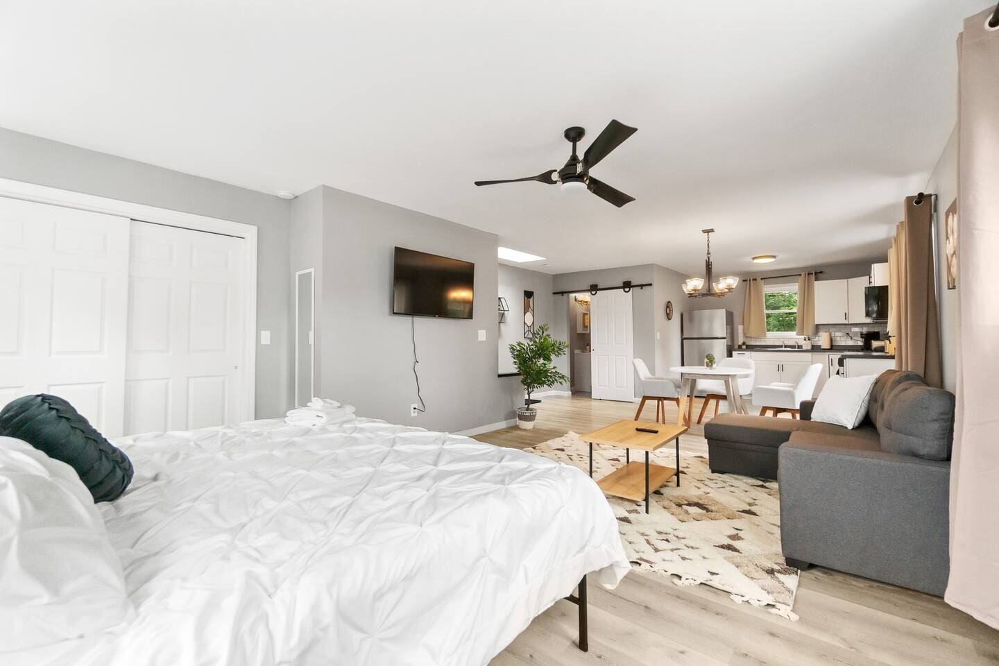 View of the living and dining area from the bed. 