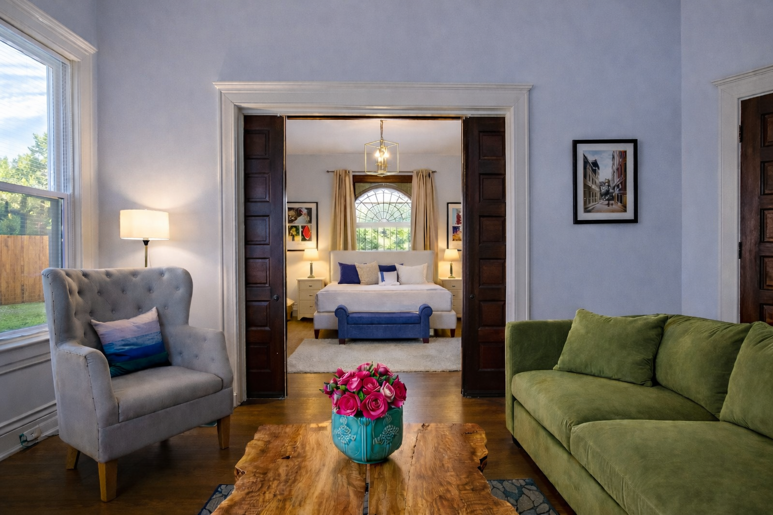 Living Room with Velvet Large Section Sofa and addition side chairs. 55" LED Smart TV.