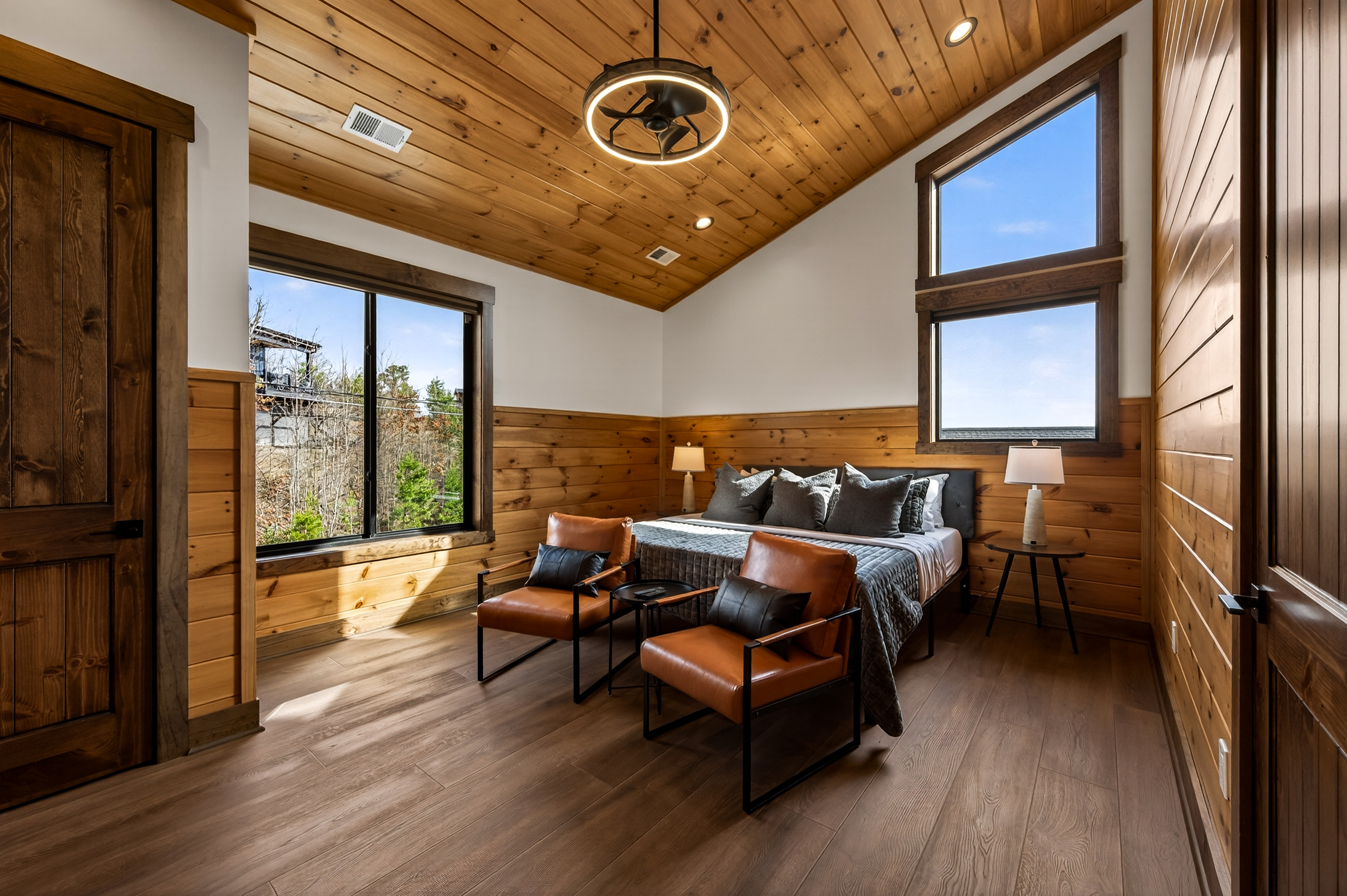 Private King Suite Retreat- on its own private wing of the home, this spacious king master bedroom features vaulted ceilings & beautiful Smoky Mountain views. Relax in the en-suite spa bathroom with a XL soaking tub, with the home gym just steps away.