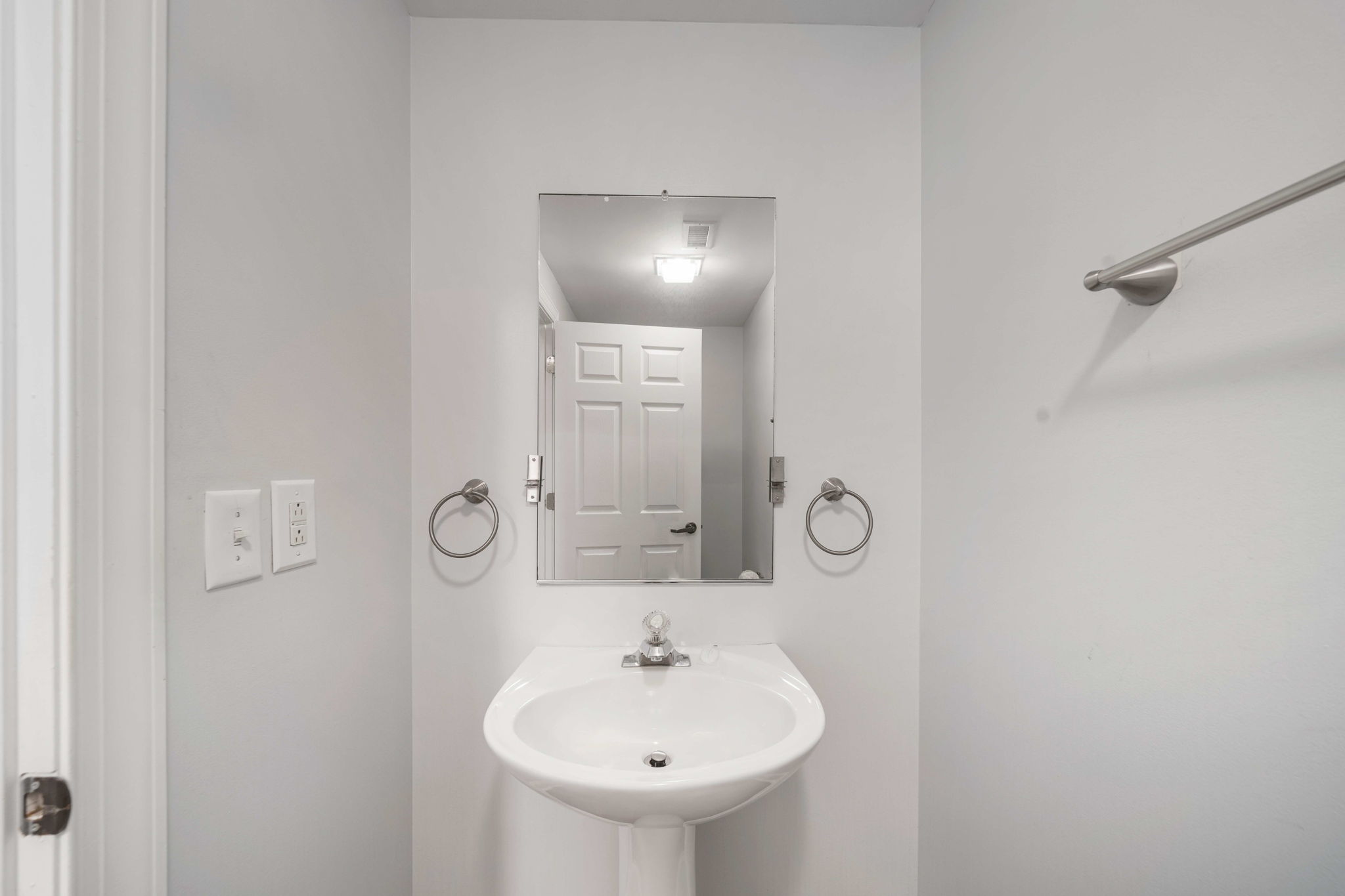 Bathroom 3: hallway half bath | Beach Breeze | Oceanview 202 | 1116 Ocean Blvd, Isle of Palms, SC | IOP Escapes