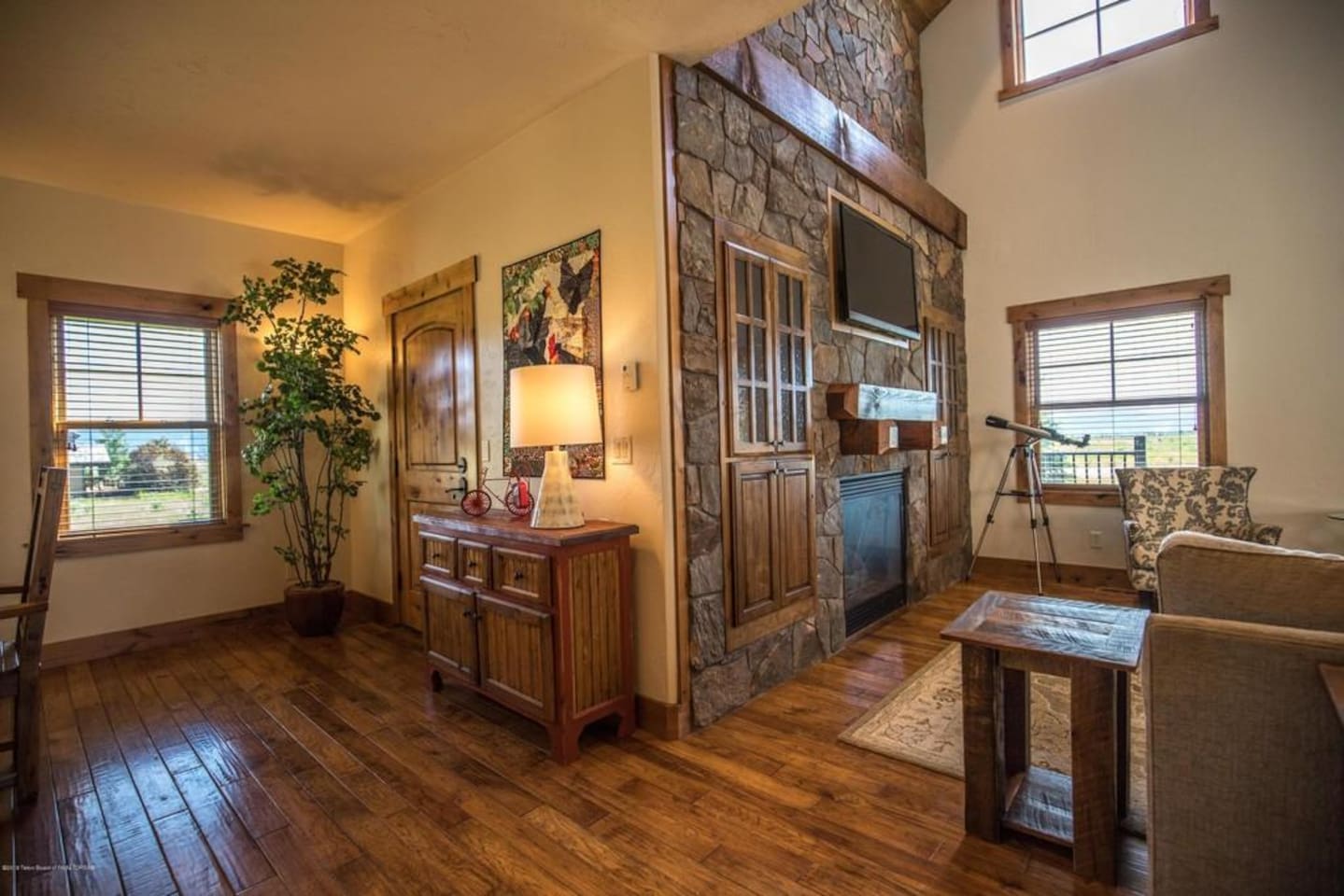 Stone fireplace, plenty of natural light