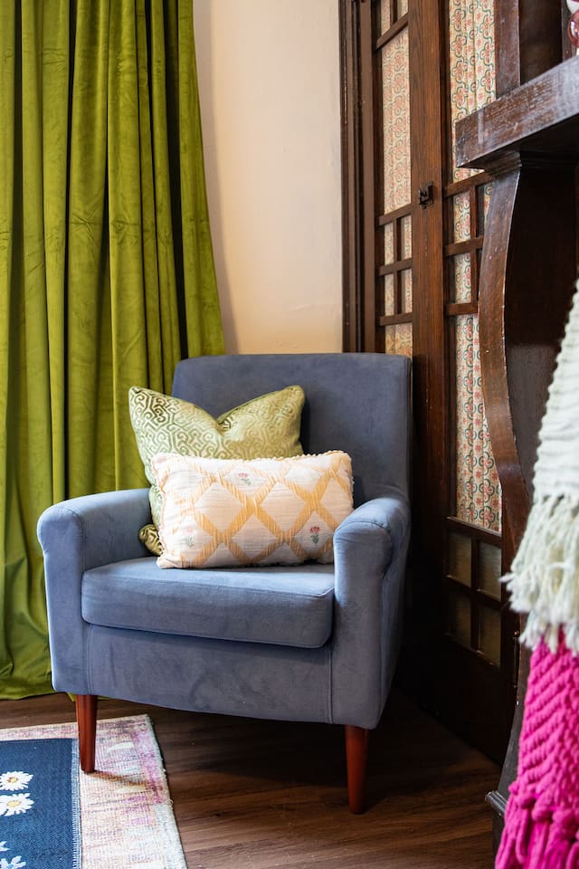Bright and spacious living room featuring a comfortable sofa bed, perfect for relaxing or accommodating extra guests.