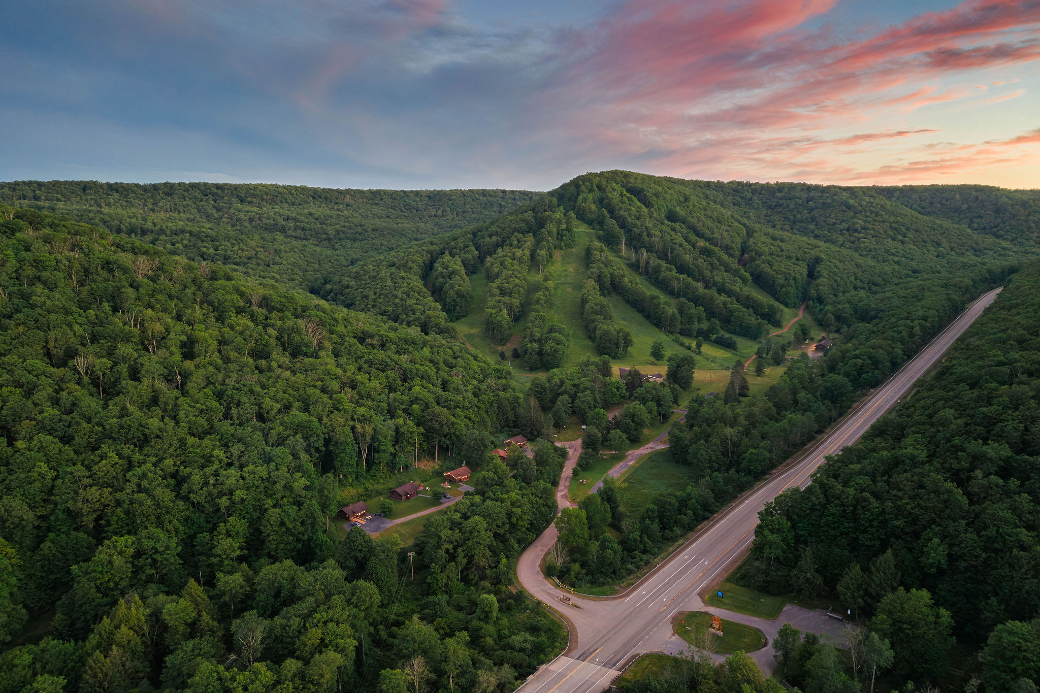 🛣 The Route 6 Scenic Byway winding through Potter County at golden hour.