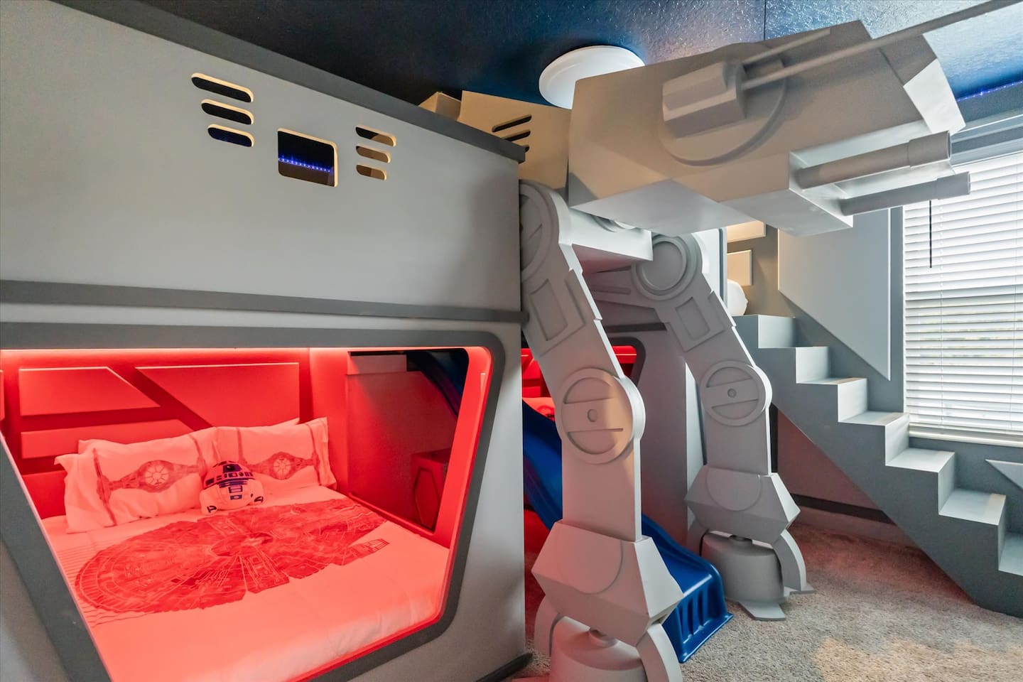 An Imperial AT-AT walker?? The kiddos (or kiddos at heart) will have a blast sleeping in our Imperial Star Destroyer bedroom complete with AT-AT walker, slide and music!