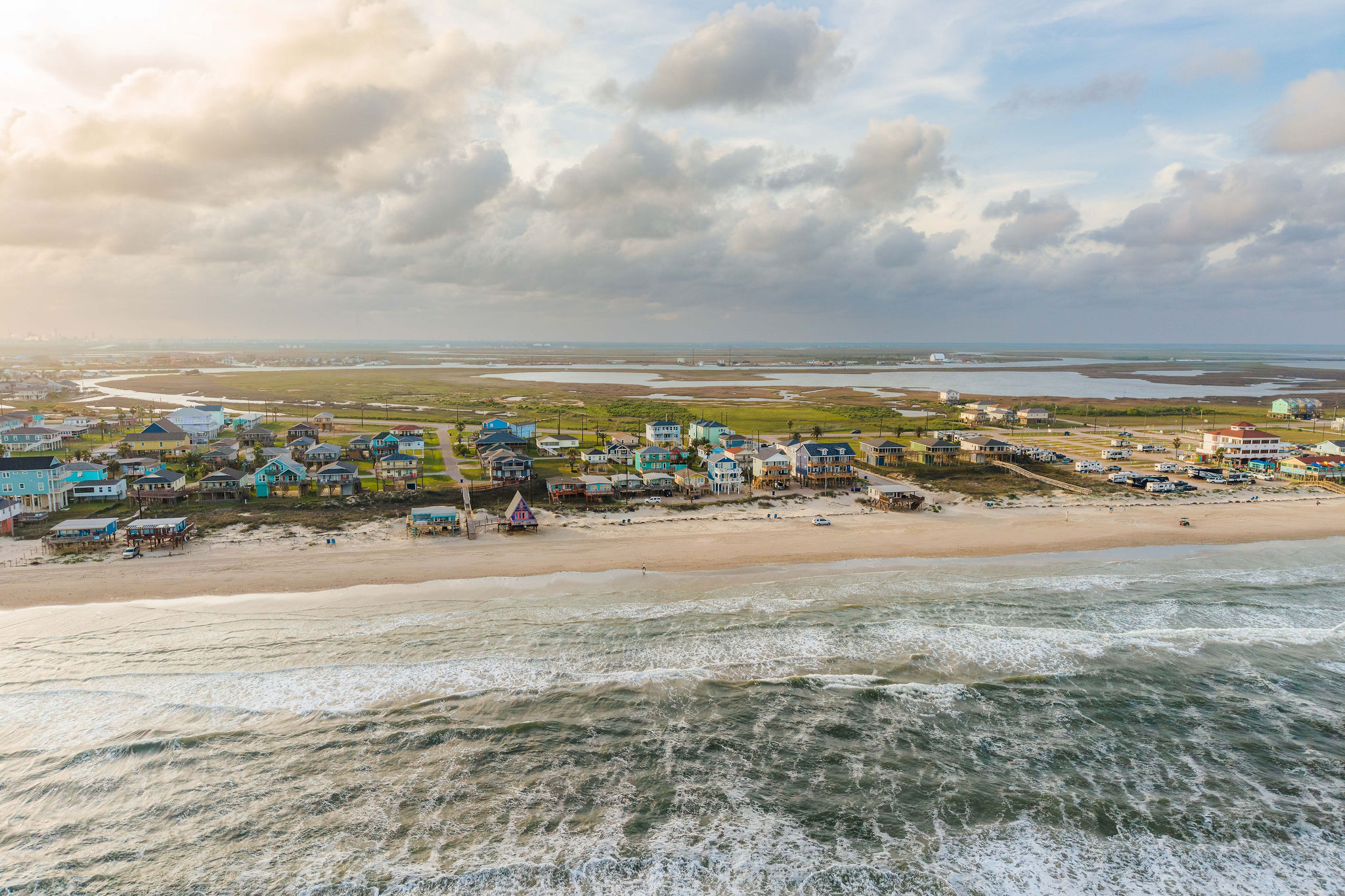 Wetlands on one side, open Gulf on the other — you're in Surfside's quieter pocket, away from the chaos.