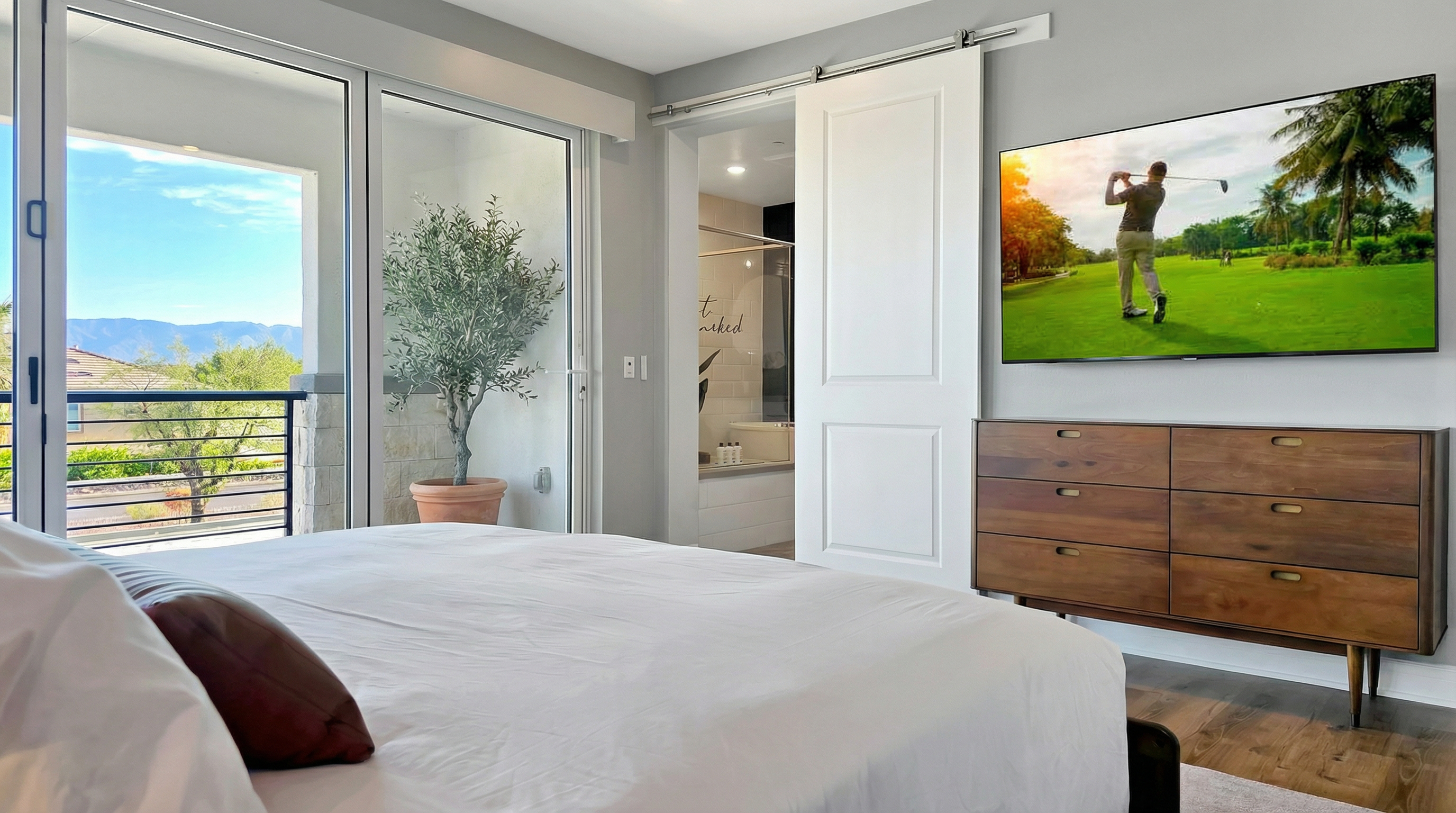 Bedroom #4 — Spacious upstairs primary suite with its own private patio overlooking stunning mountain views.