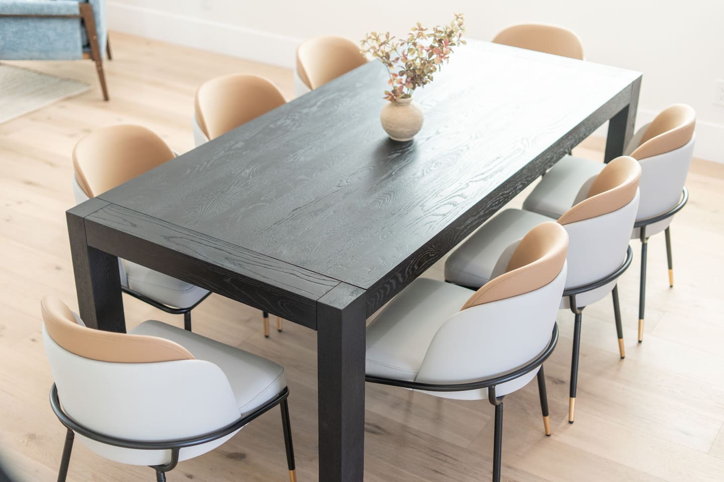Neutral tones paired with clean lines highlight the dining area’s contemporary aesthetic.