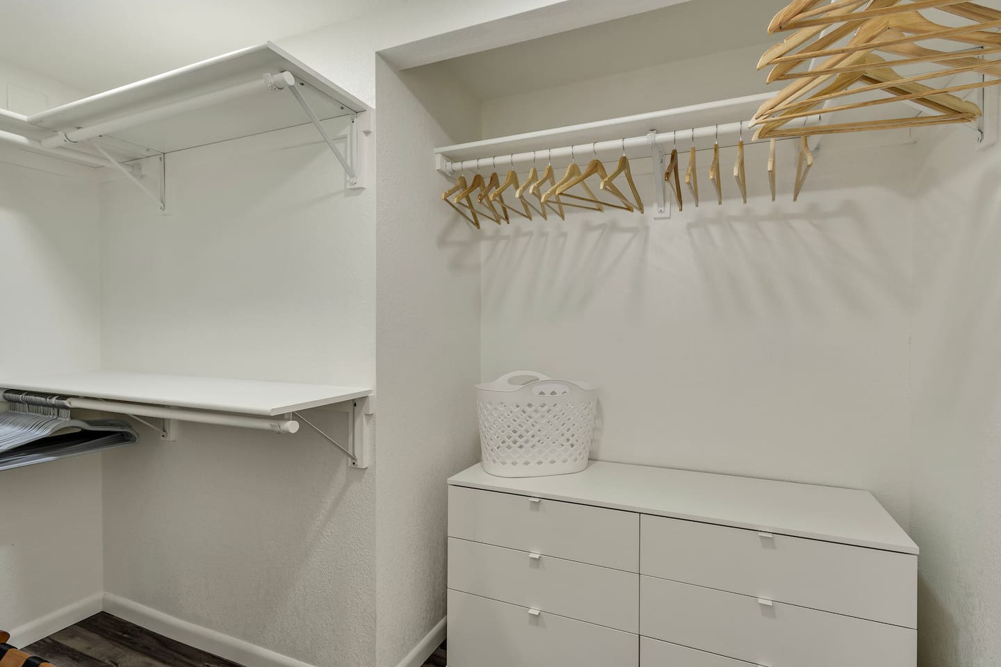 Master closet with dresser and hanging storage.