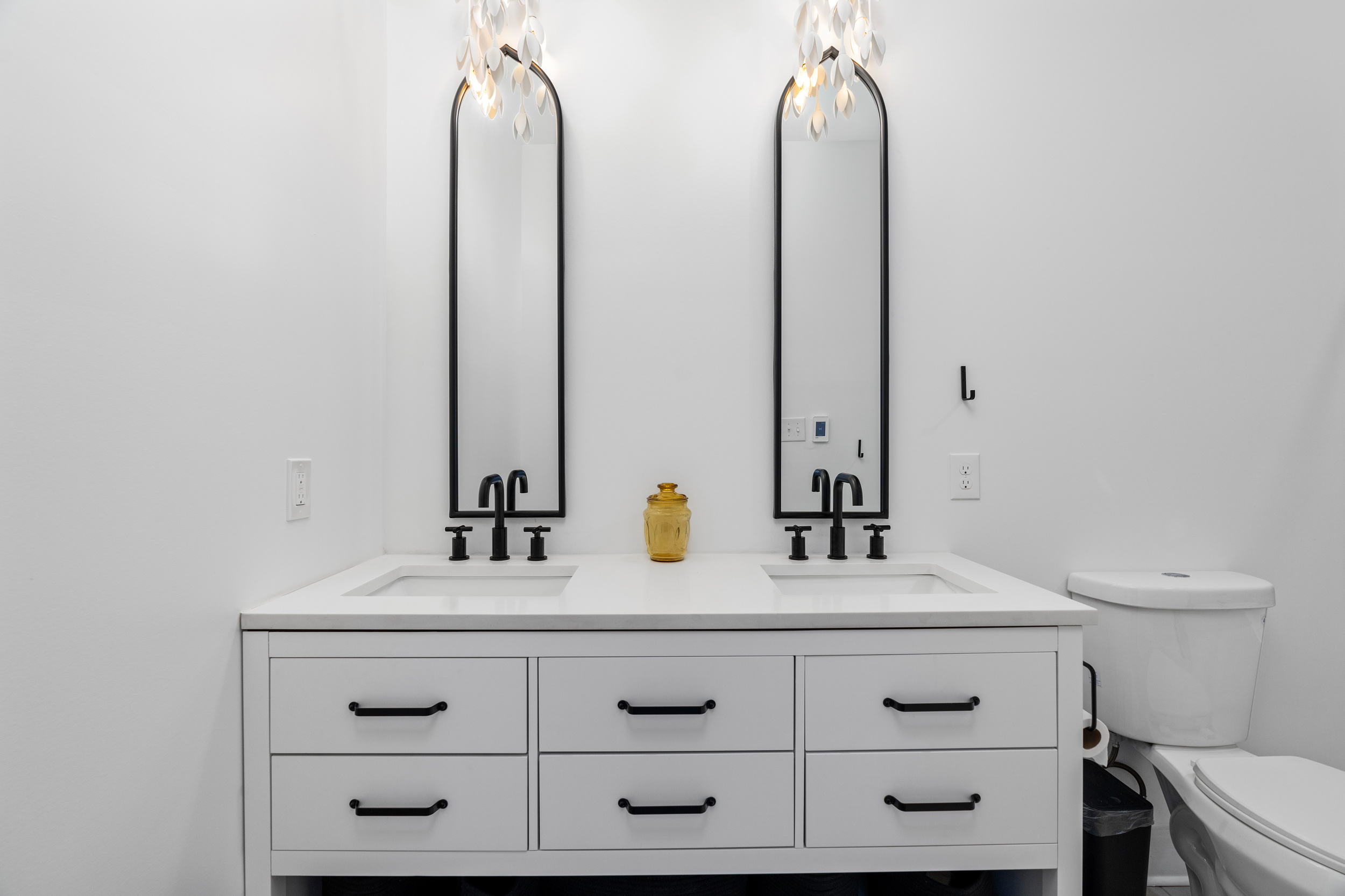 Elegant Bathroom: Dual sinks and chic lighting for a refreshing retreat in Powhatan!
