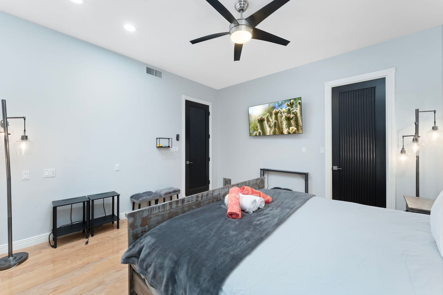 Bright and inviting bedroom with chic décor, natural wood tones, and plush bedding for restful nights.