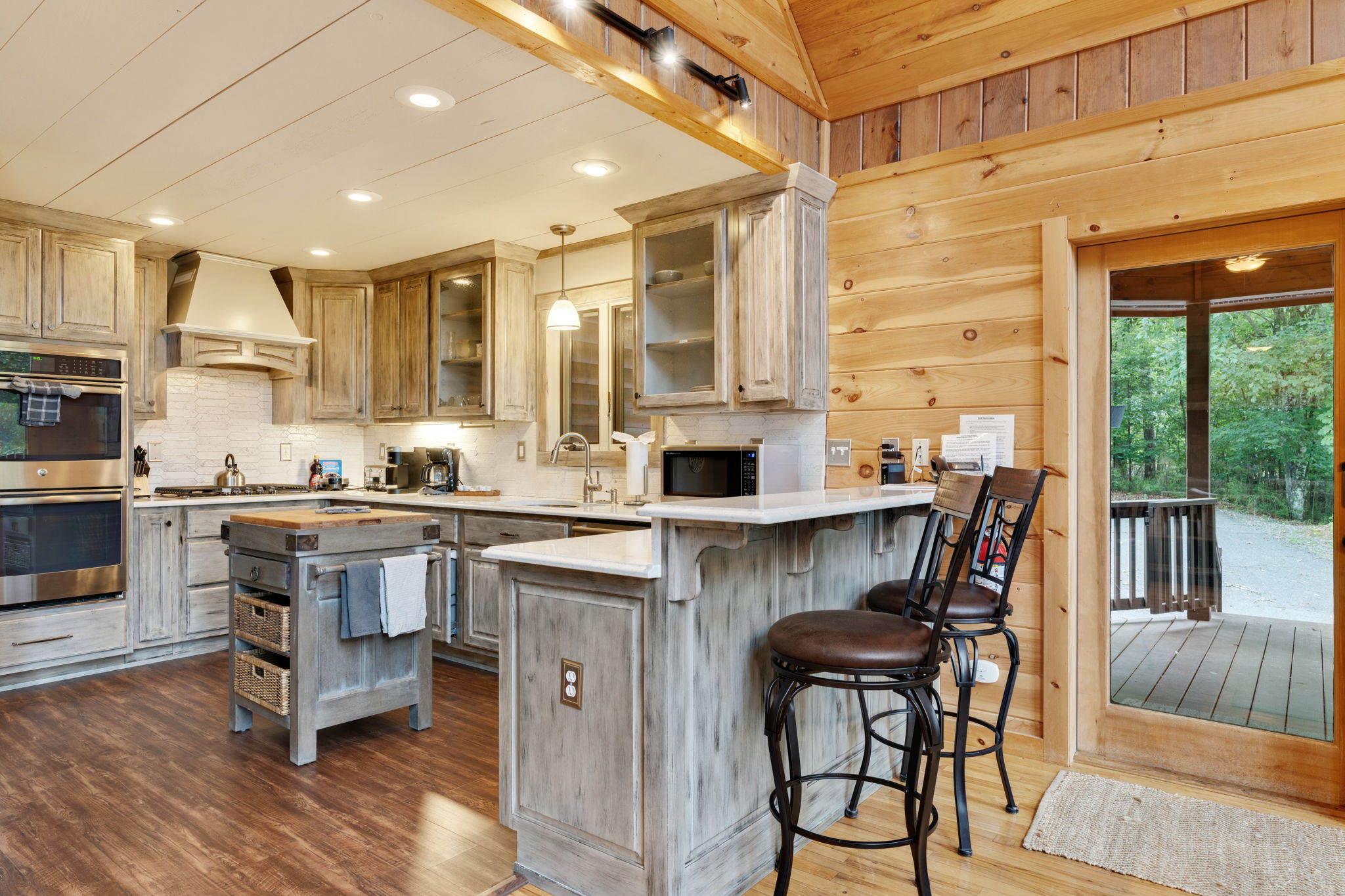 Kitchen with bar stools for extra seating.