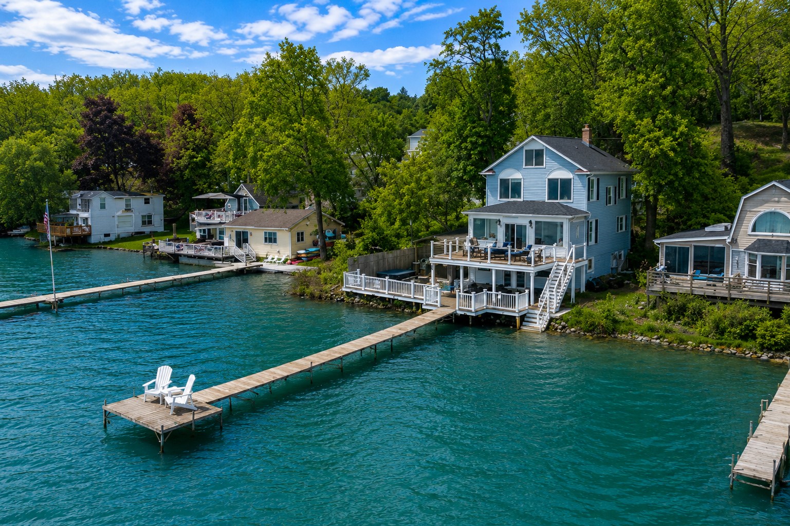 Stunning lakefront home with multi-level decks and a private dock—perfect for sunrise coffees and sunset cocktails 🌅🏡🚤