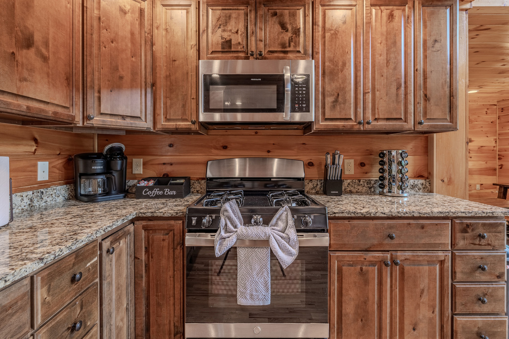 Full-size appliances, generous counters, and open sightlines make the kitchen a functional hub for the group.