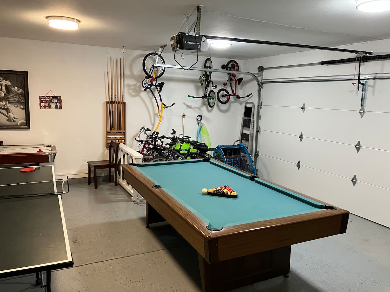The large, 2-car garage is your bonus room! Ping pong table, pool table, air hockey, couch, and bikes galore!