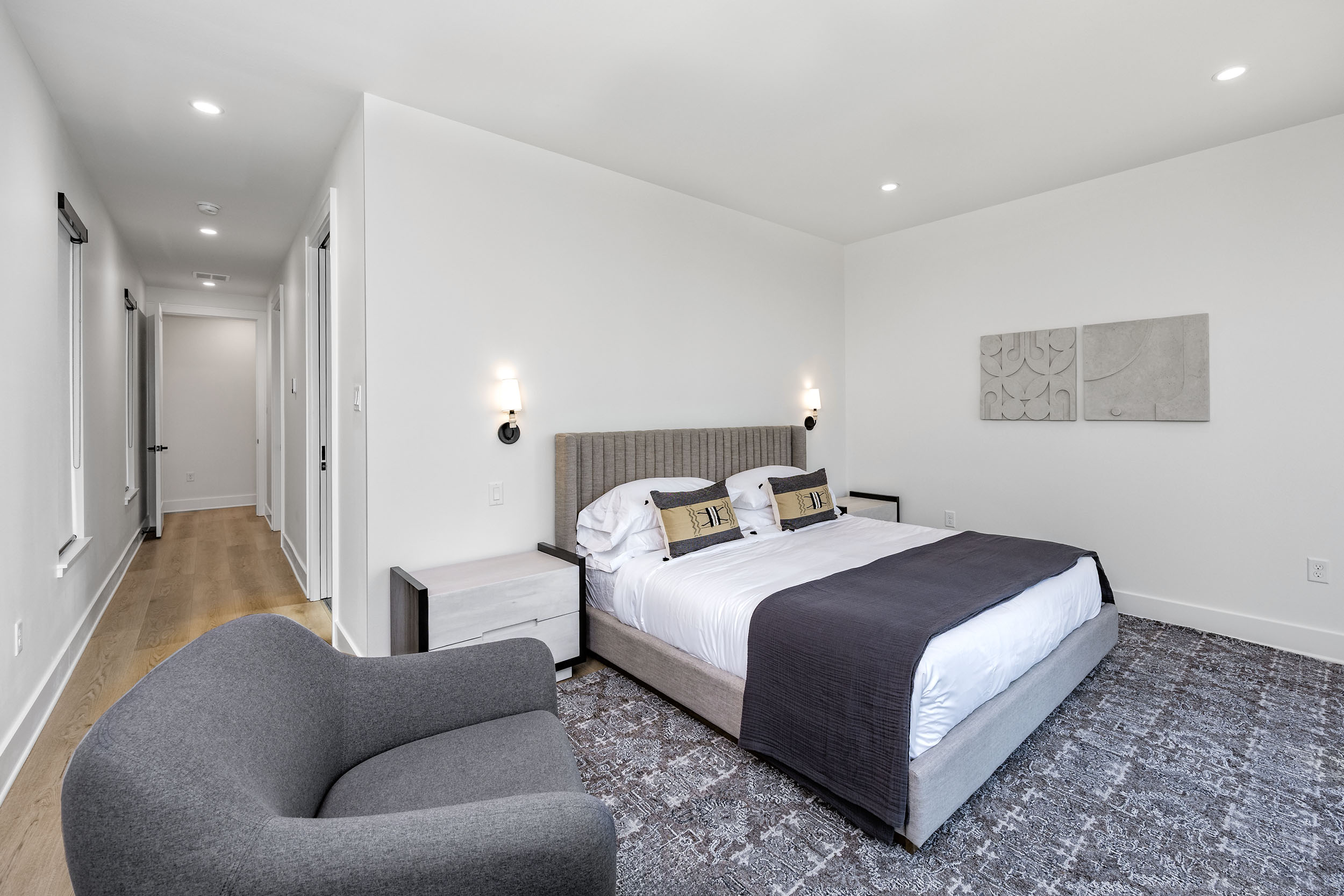 Wake up to peaceful treetop lake views in this serene king suite featuring modern comfort and direct view of the lake through the sliding glass balcony doors that bring the outside in.