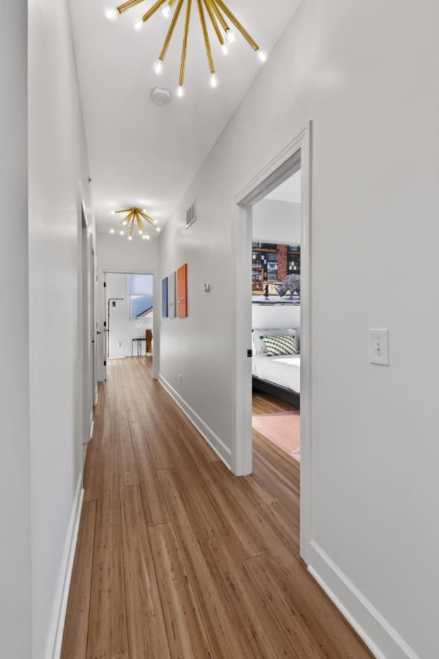 Elegant wooden flooring leads you to cozy bedrooms—an inviting and spacious hallway perfect for a comfortable stay