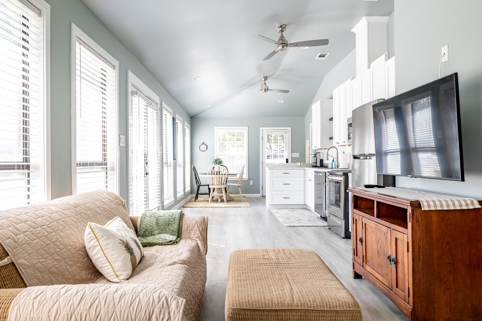 Living room & kitchen area w/tons of natural light