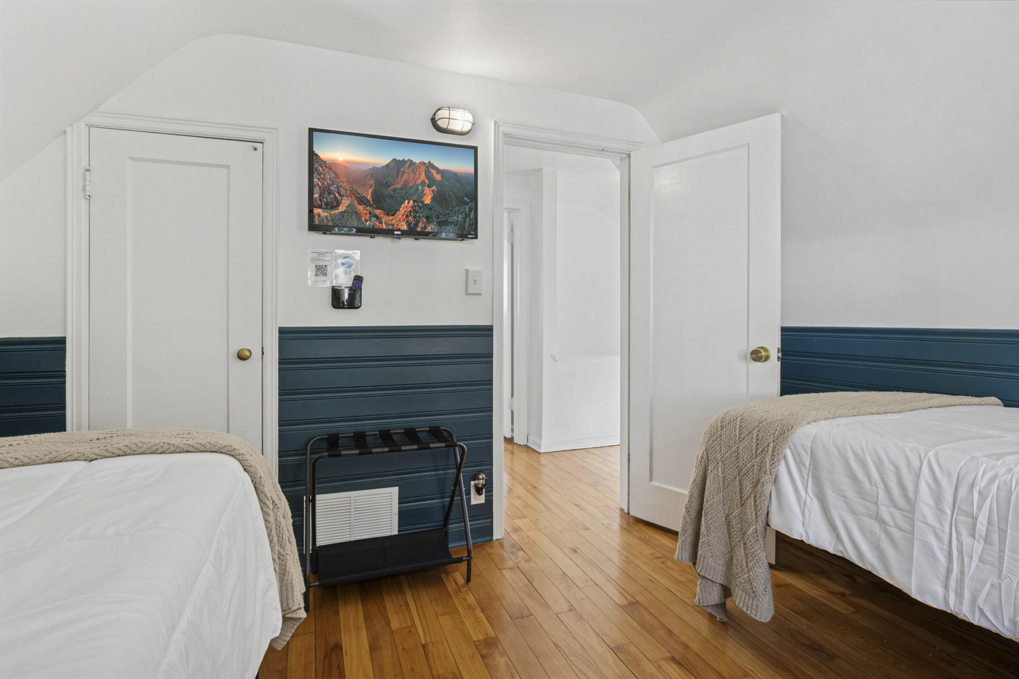 Rest easy—our twin bedroom features a wall-mounted TV with a remote holder, so no more endless searching. Cozy, kid-friendly comfort near Notre Dame.