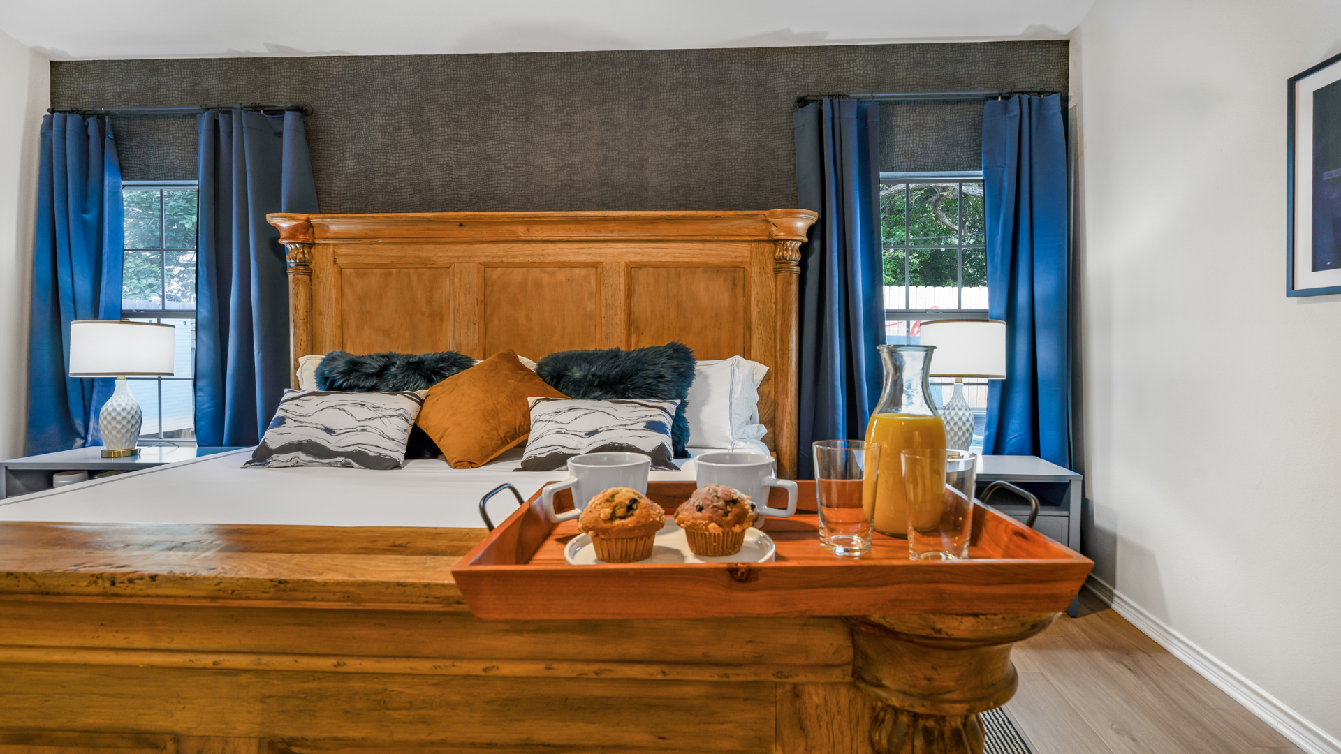 Start your day with a cozy breakfast in bed! Bring your favorite muffins and juice to enjoy on the beautiful tray provided. Relax against plush pillows in this serene, elegant space and let th