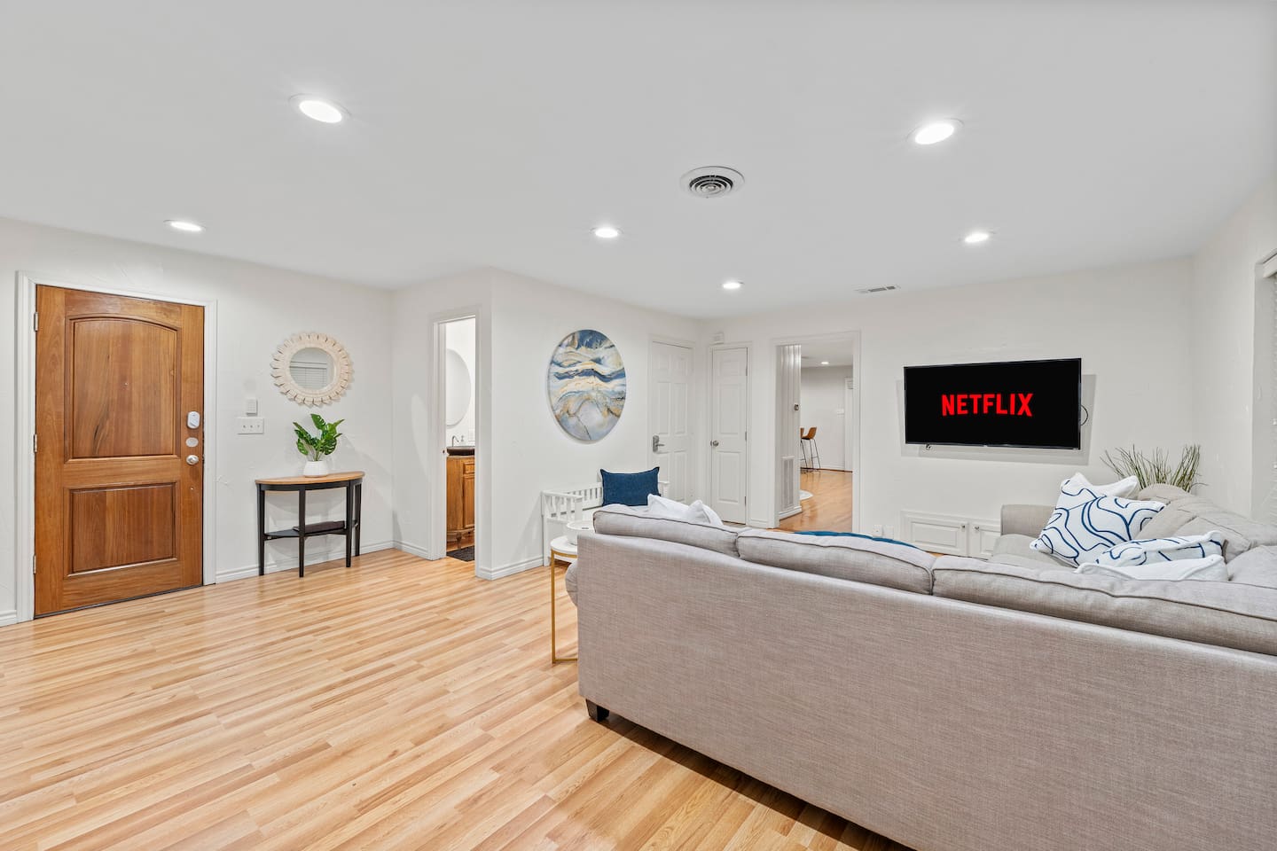 A half-bathroom sits directly near the living area with a console table for setting your things down after settling in!