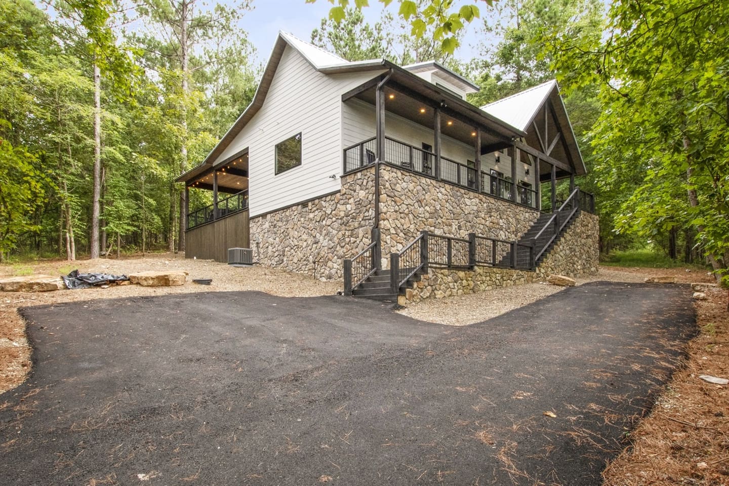 Enjoy serene forest views right outside your door, with easy access to top spots like Mountain Fork Brewery and Beavers Bend State Park.