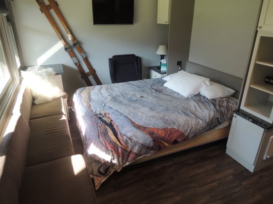 Pull-down murphy bed: Full-size bed.