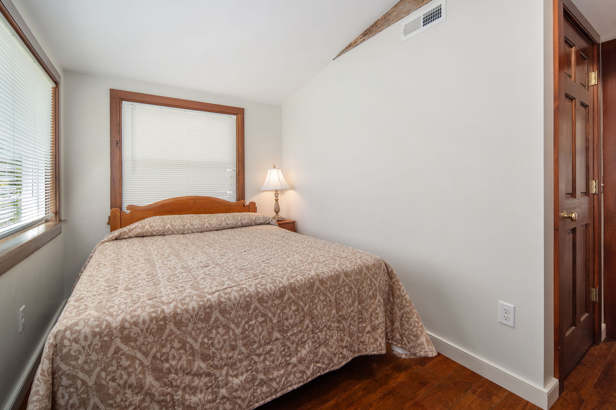 Rest comfortably in this inviting queen bedroom.