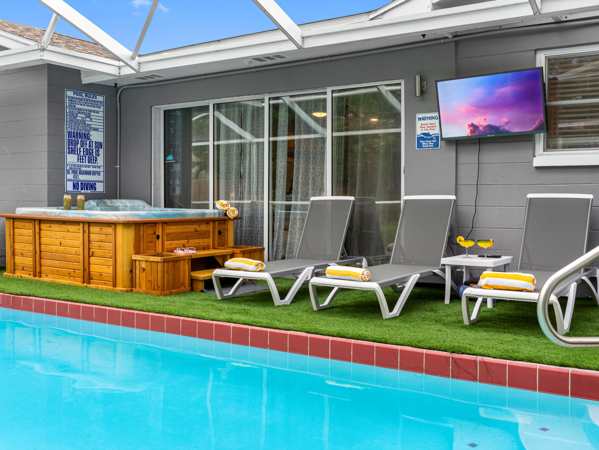 Kick back on a cushioned lounger, cocktail in hand, and soak in the sun by the sparkling screened-in pool.