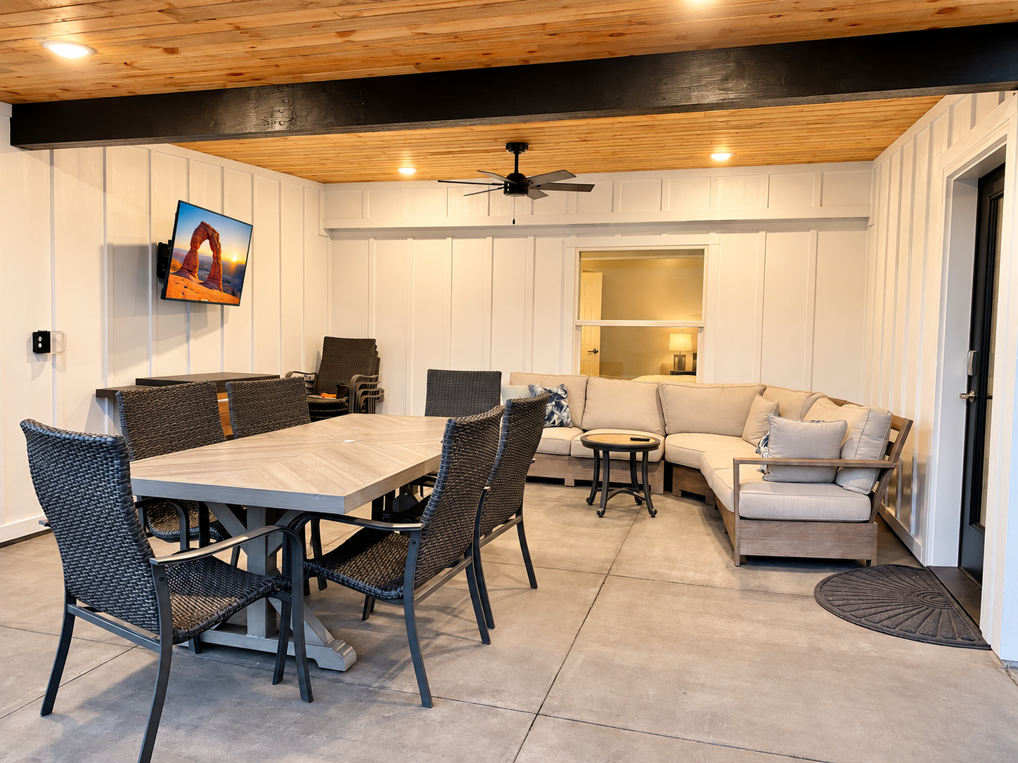 Covered outdoor living space with TV