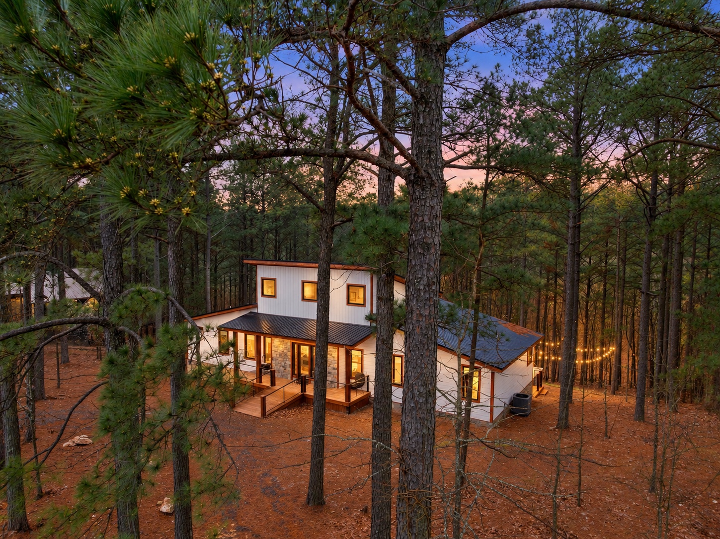 Escape into the pines, where warm windows welcome you home.