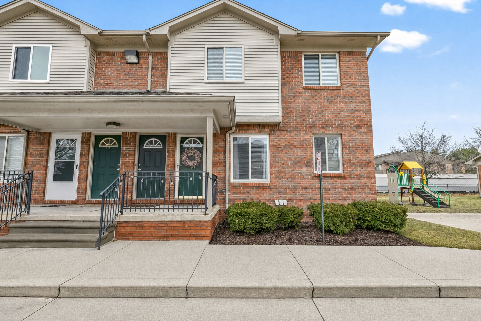 Well-maintained condo in a quiet, family-friendly community with sidewalks, green space, and a nearby playground.