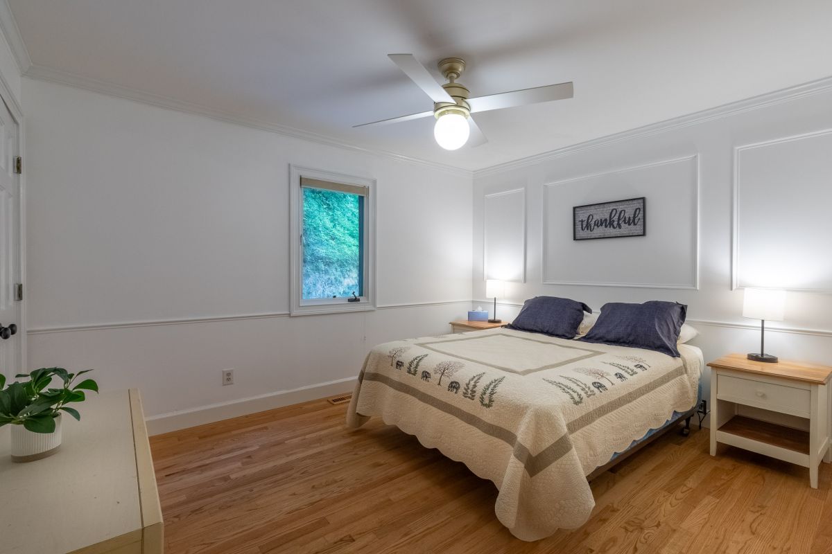 Bedroom: Bright room with hardwood floors, plush bedding, and serene views for peaceful slumber!
