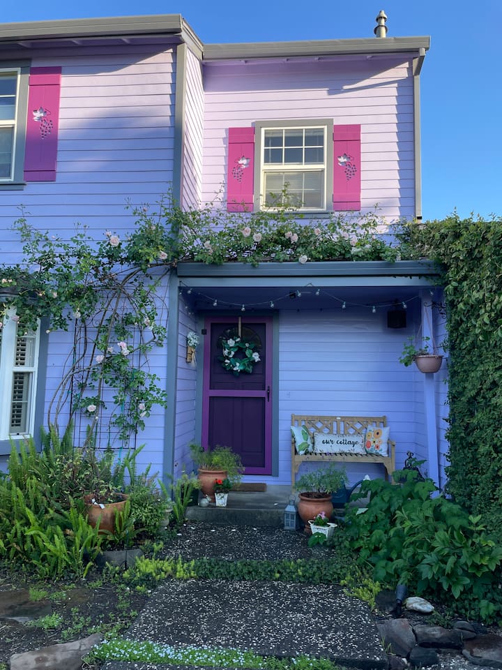 Enjoy the peaceful patio and charming front yard, with greenery, flowers, and cozy outdoor seating for relaxing moments throughout your stay.
