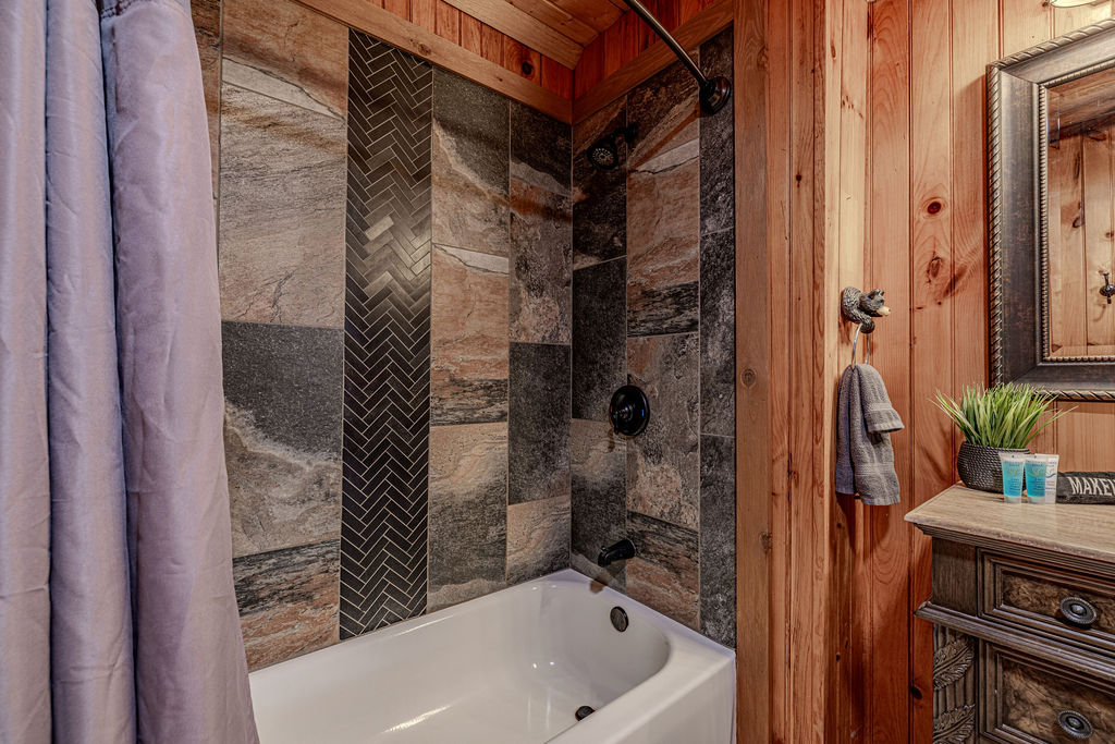 Walk-in shower with modern tile and glass door