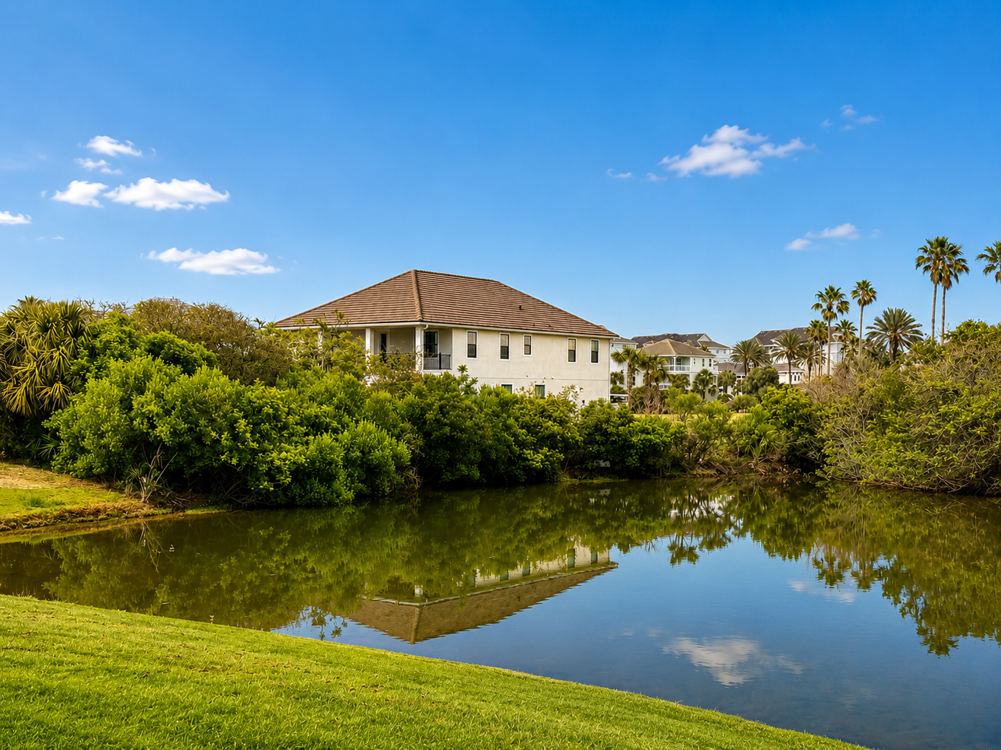 Framed by palms and mirrored in tranquil water, your coastal retreat sits in a scene of postcard calm. Take it in on an evening walk around the lake—this peaceful setting is the gentle backdrop to a week your family simply won't forget.