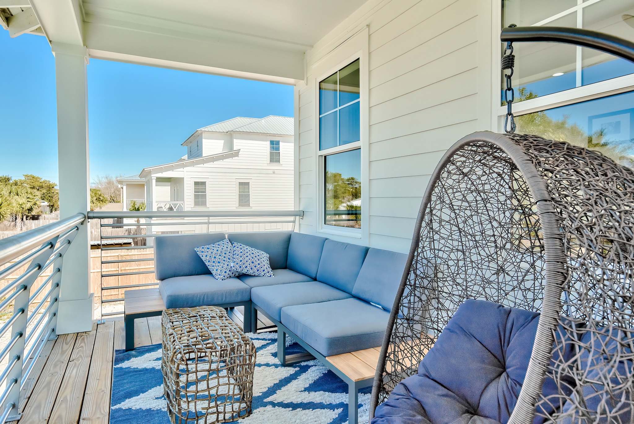 Multiple balconies outfitted with sleek, comfortable furniture