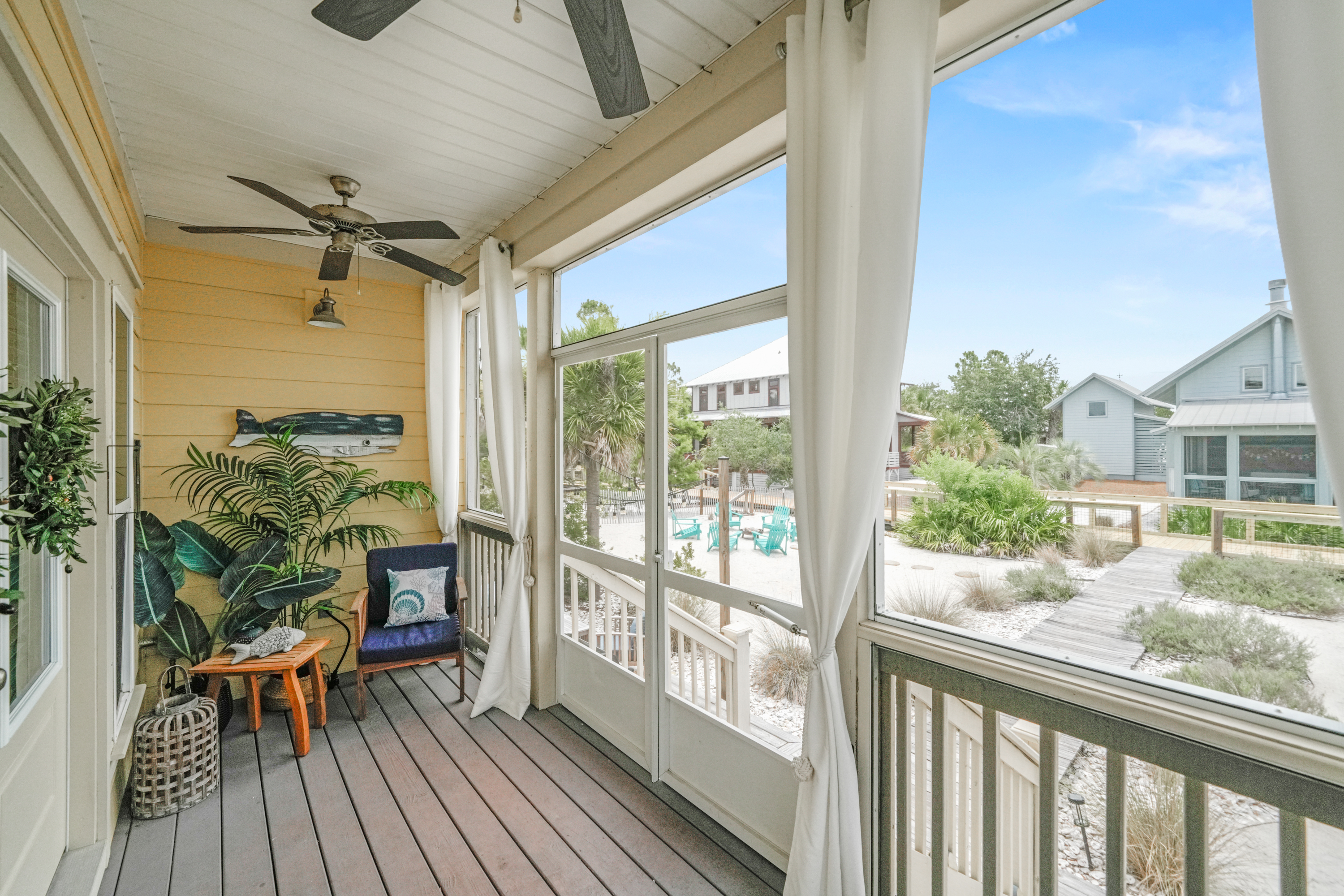 Enjoy morning coffee or evening cocktails from the comfort of the screened-in porch overlooking the neighborhood