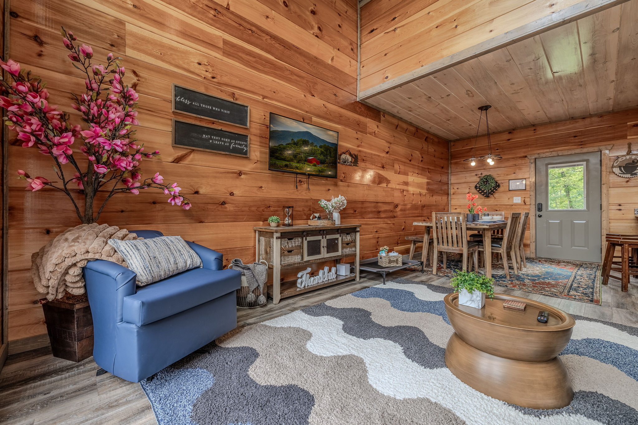 The main living area opens to the deck, dining space, and kitchen for easy group connection.