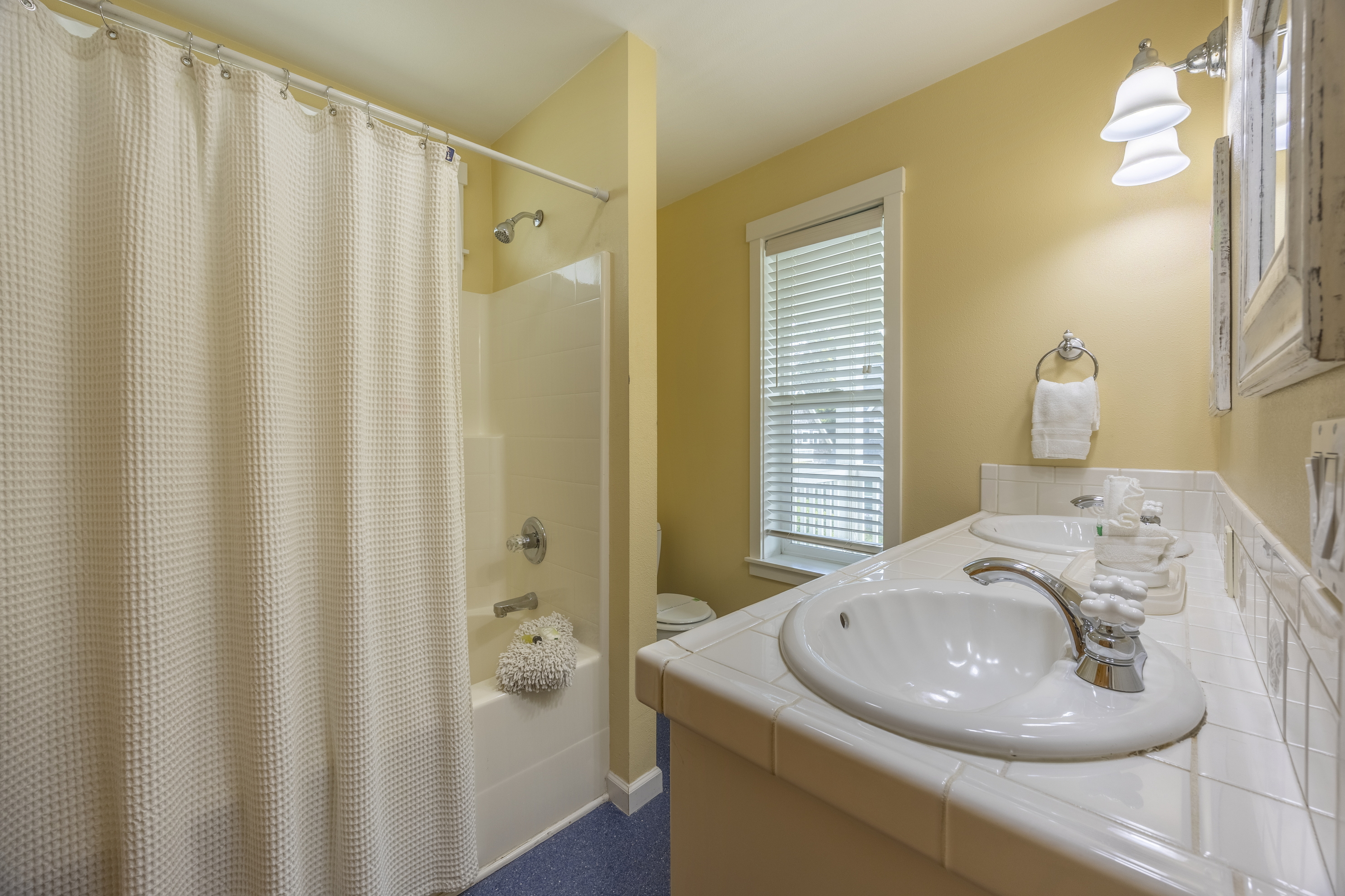 Unwind in style — the master bath offers a soaking tub, convenient handheld shower, and a walk-in closet for all your essentials.