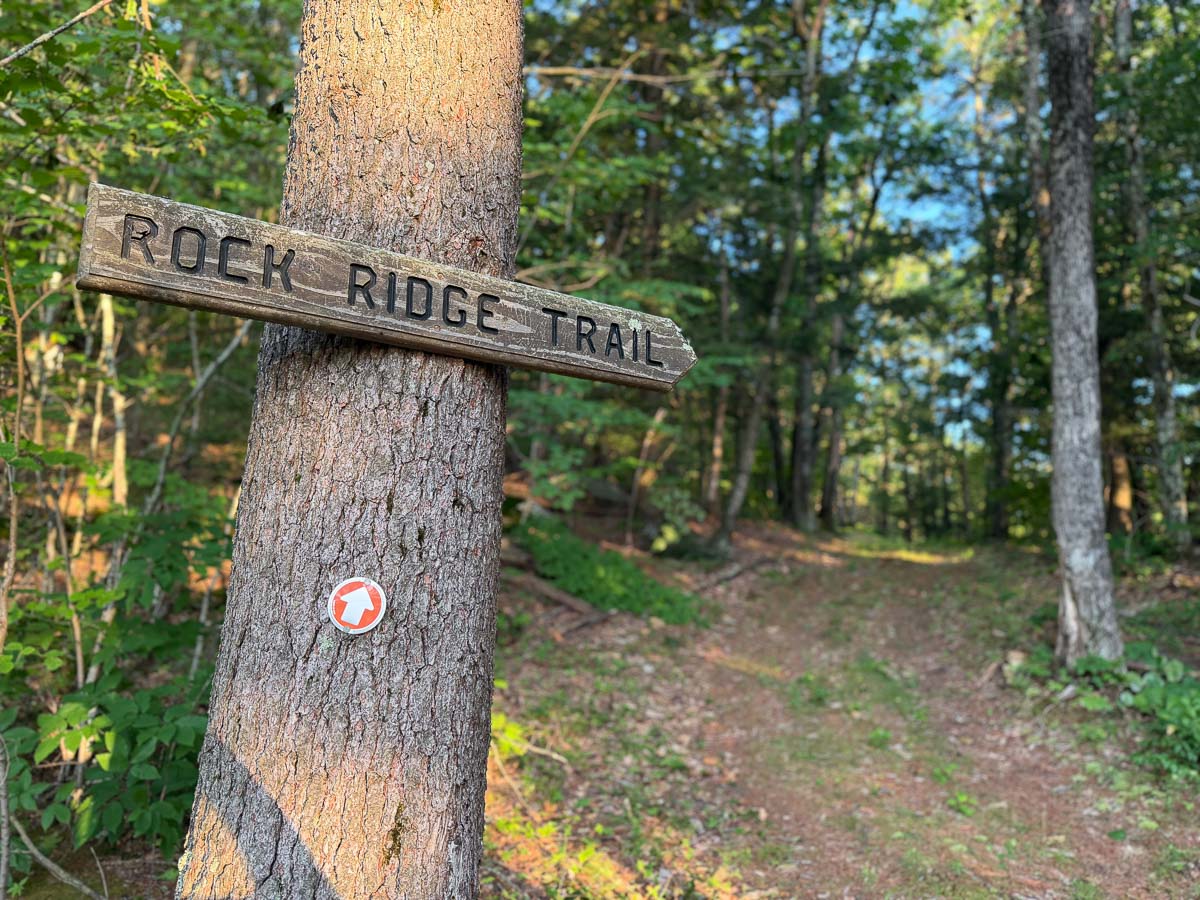 Hand-cut Rock Ridge trail sign on Woodruff Mountain &mdash; Sunset Falls Estate