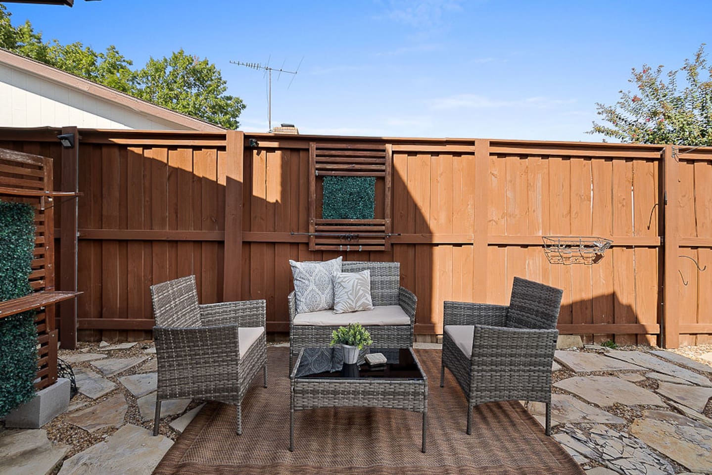 Lounge outdoors, poolside, in the fully-fenced, private backyard equipped with an outdoor seating area