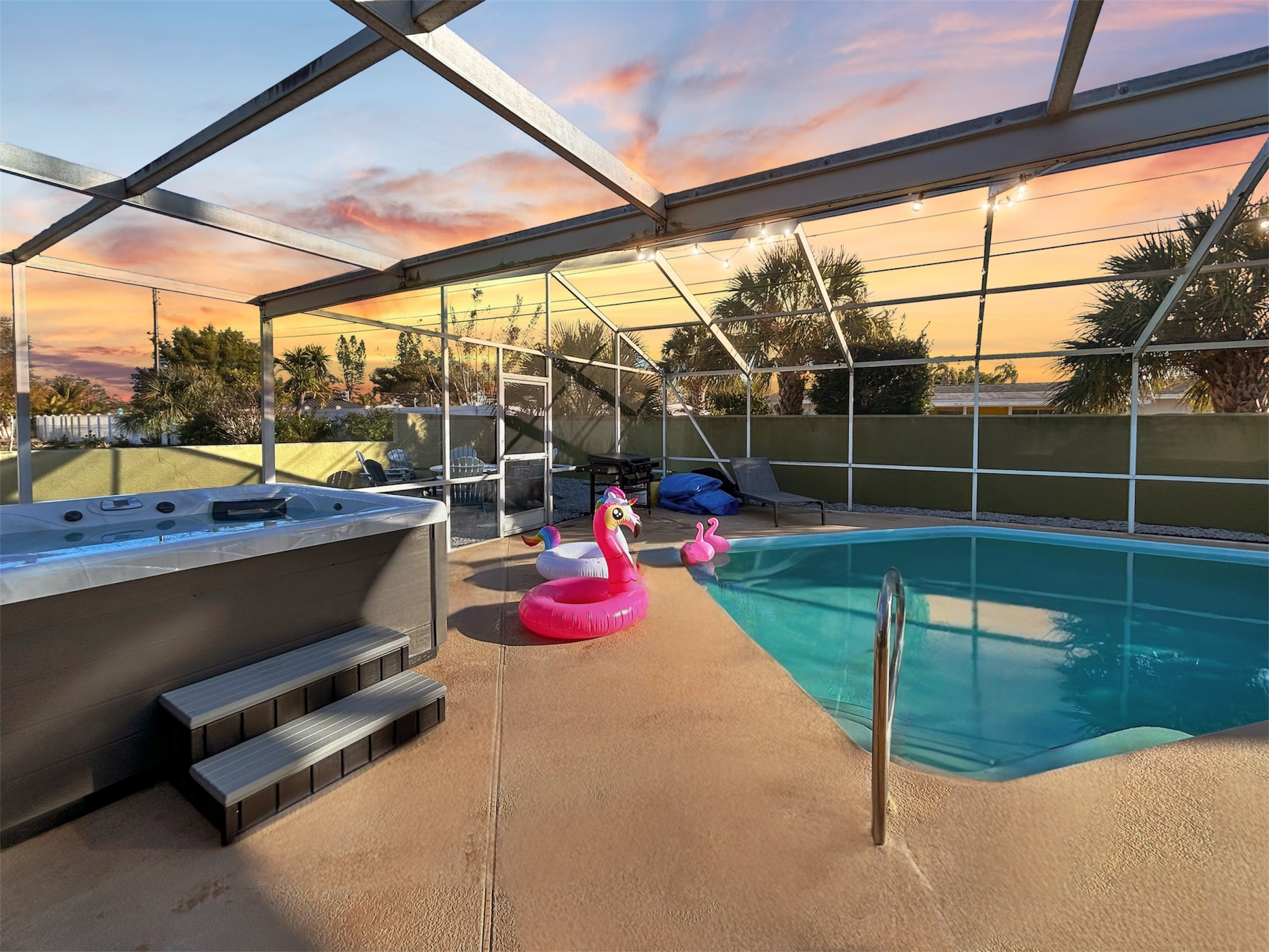 Screened-in pool oasis with relaxing spa to help soak up the Florida sun.