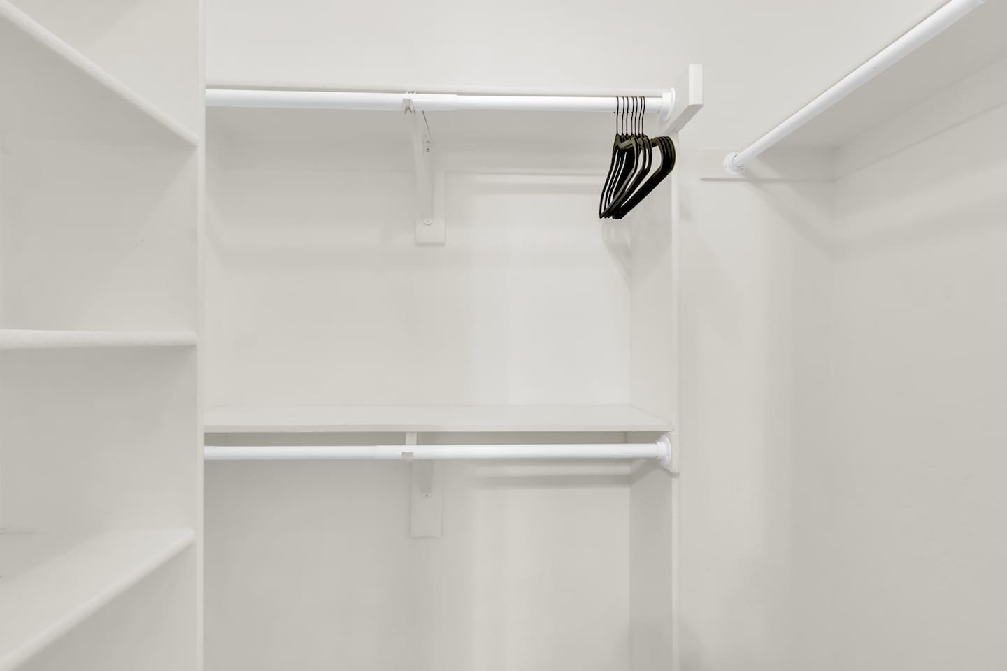 Large walk-in closet in the primary suite, designed for convenience with plenty of hanging and storage space.