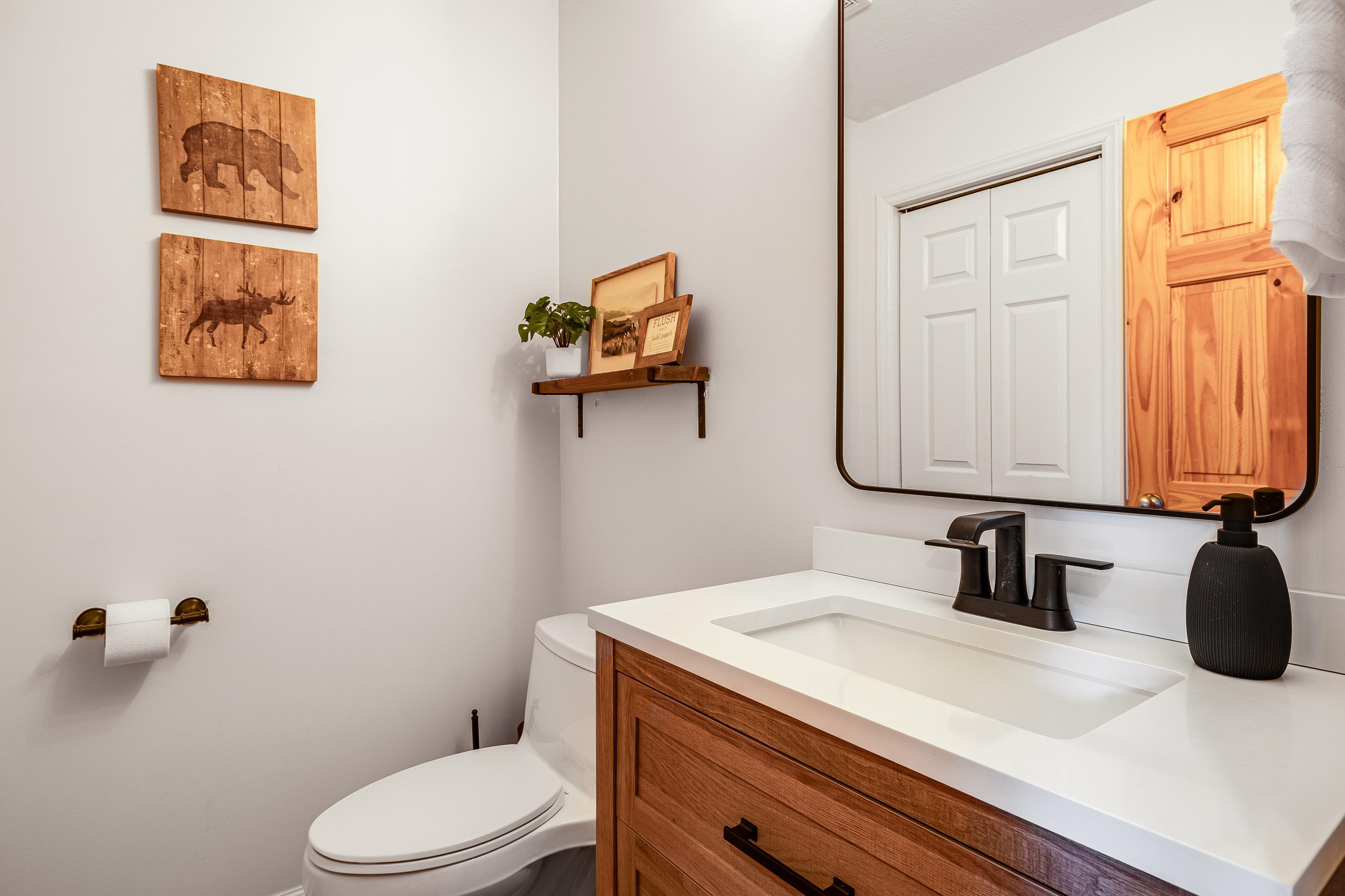 Main level half bathroom located just off the living room area.