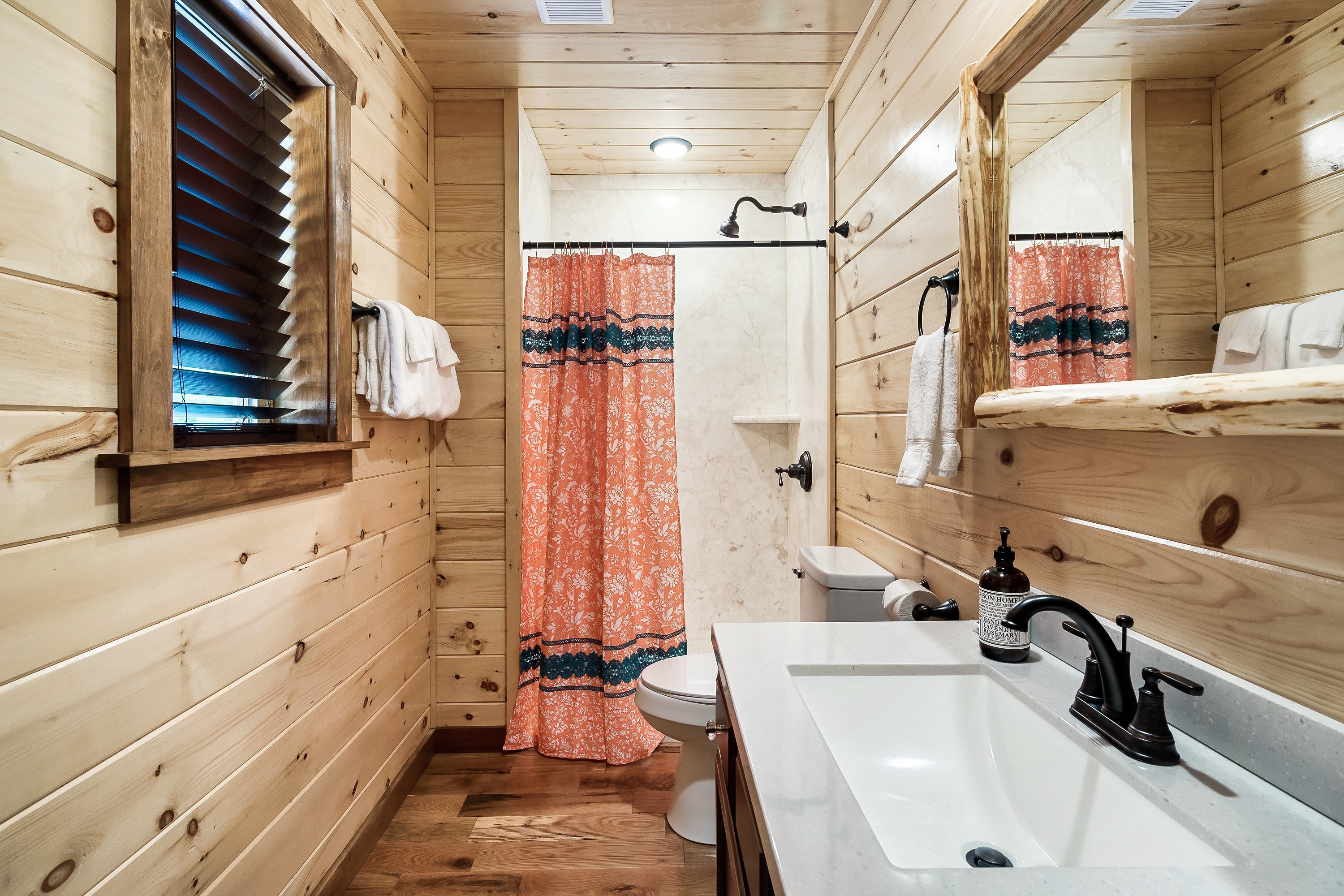 The "Pretty as a Peach" bathroom has a walk in shower